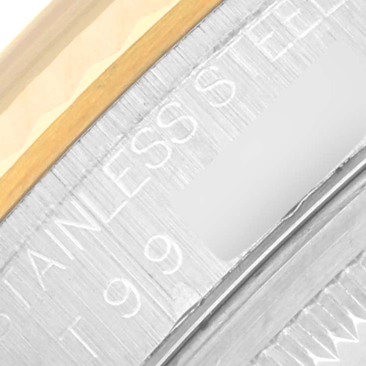 This close-up image shows part of the bezel and the engraved inscription on the side of the case of a Rolex Datejust 16233 Men's Steel and Gold (two tone) Black Dial 16233 Men's Steel and Gold (two tone) Black Dial watch.