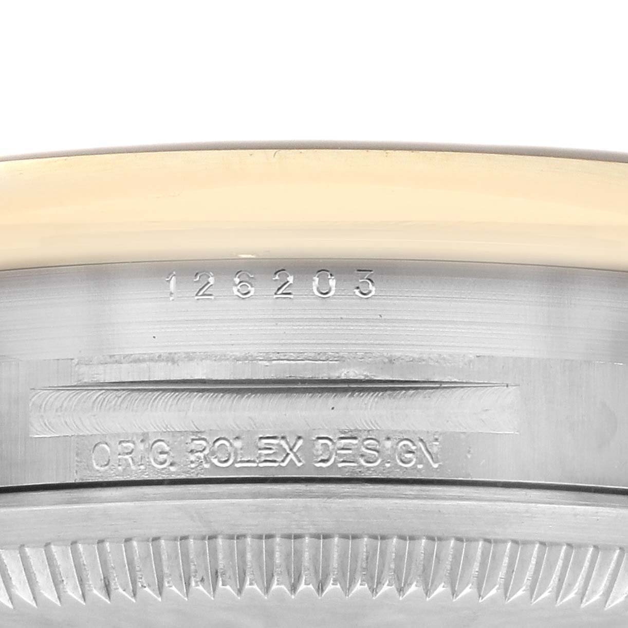 The image shows a close-up of the model number and "ORIG. ROLEX DESIGN" engraving on the case of a Rolex Datejust 126203 Men's Steel and Gold (two tone) Champagne Dial 126203 Men's Steel and Gold (two tone) Champagne Dial watch.