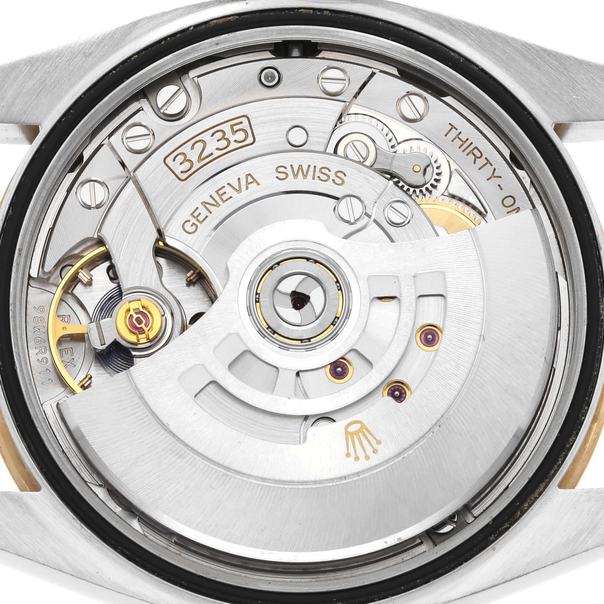 This is a close-up view of the Rolex Datejust 126203 Men's Steel and Gold (two tone) Champagne Dial 126203 Men's Steel and Gold (two tone) Champagne Dial watch movement, displaying the intricate mechanical components.