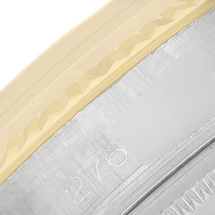This close-up image shows a part of the bezel and case of a Rolex Datejust 1601 Men's Steel and Gold (two tone) Champagne Dial 1601 Men's Steel and Gold (two tone) Champagne Dial watch.