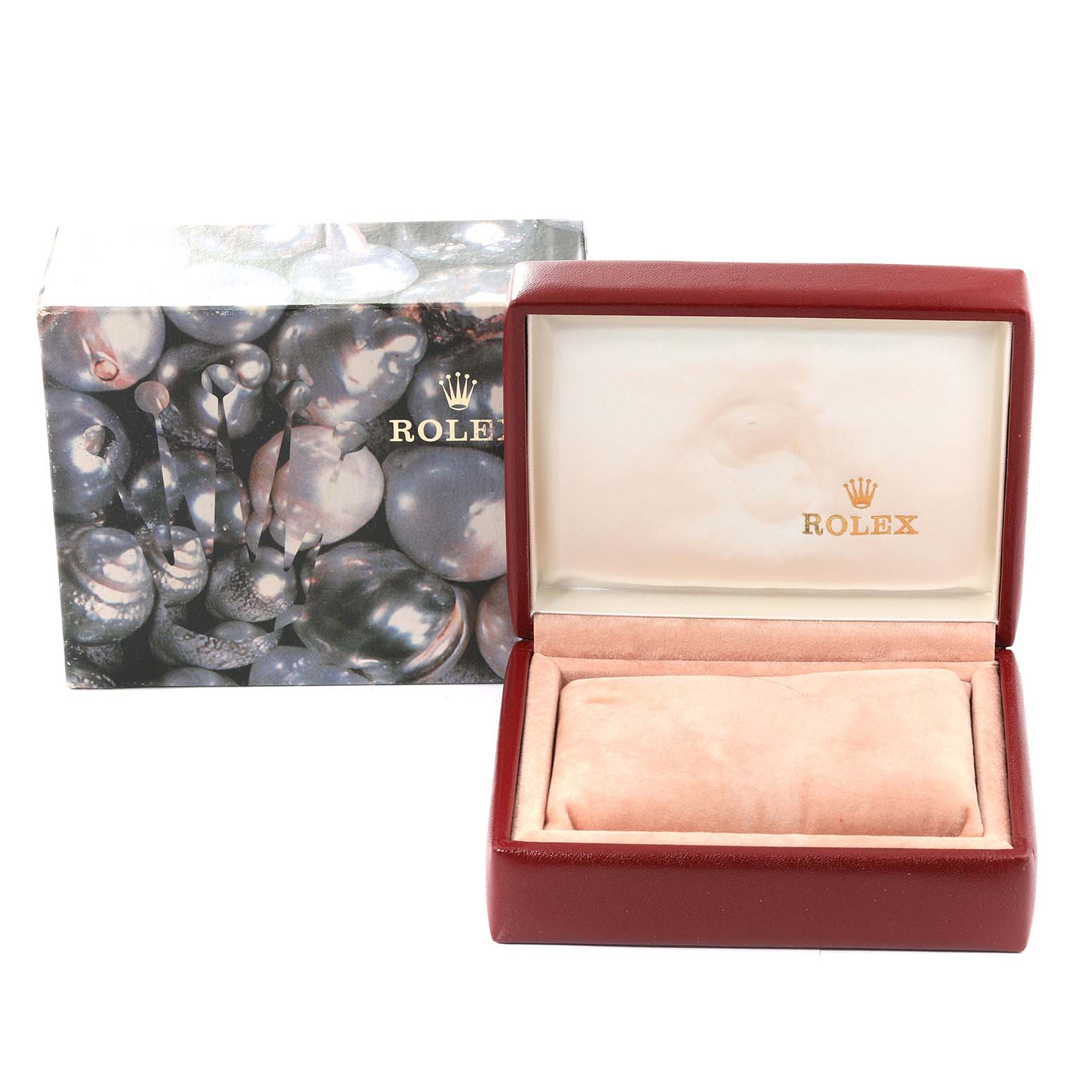 The image shows an open red Rolex Datejust 69173 Women's Steel and Gold (two tone) Champagne Dial 69173 Women's Steel and Gold (two tone) Champagne Dial watch box with a Rolex-branded cushion inside, and its external packaging in the background.