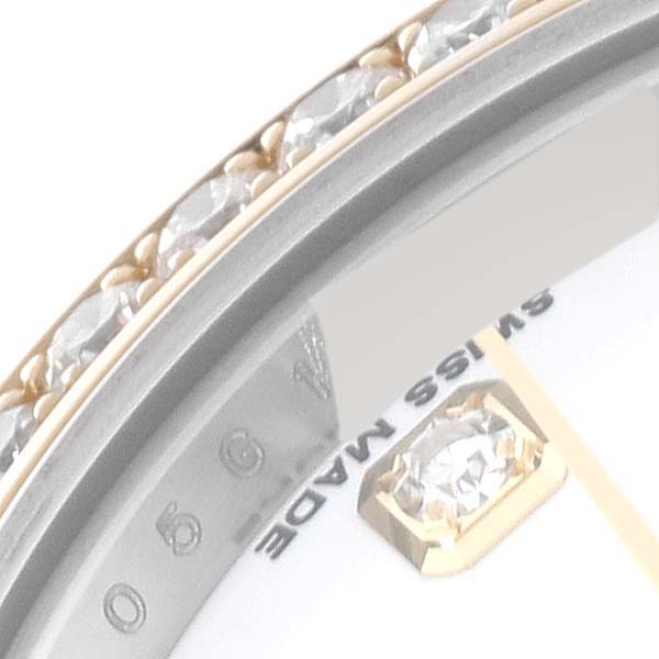 The image shows a close-up of a Rolex Datejust 179383 Women's Steel and Gold (two tone) White Dial 179383 Women's Steel and Gold (two tone) White Dial watch featuring part of the bezel with diamonds and the "Swiss Made" text.