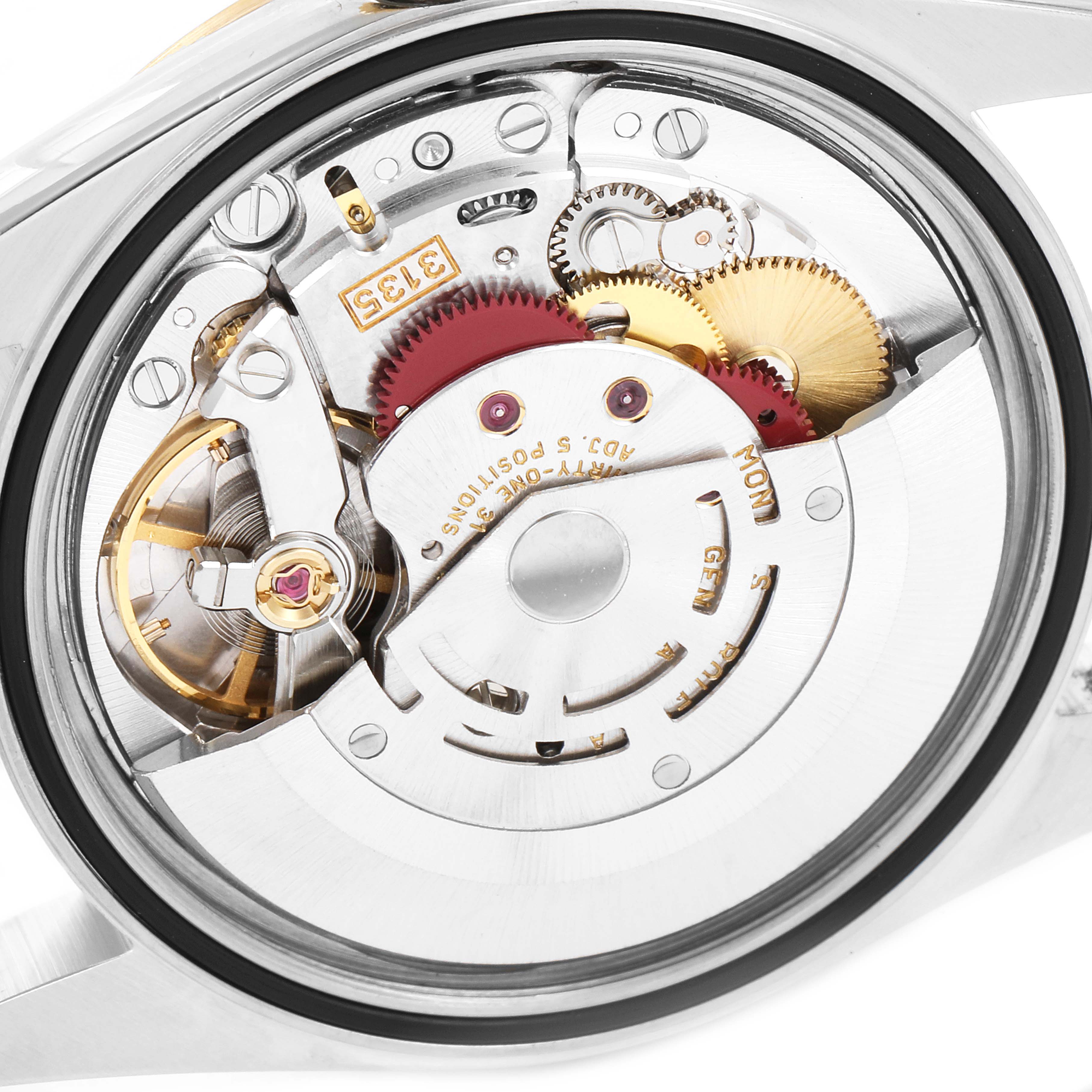 This image shows the open back view of the Rolex Datejust 16233 Men
s Steel and Gold (two tone) Grey Dial 16233 Men
s Steel and Gold (two tone) Grey Dial
s movement mechanism, showcasing gears and components inside.