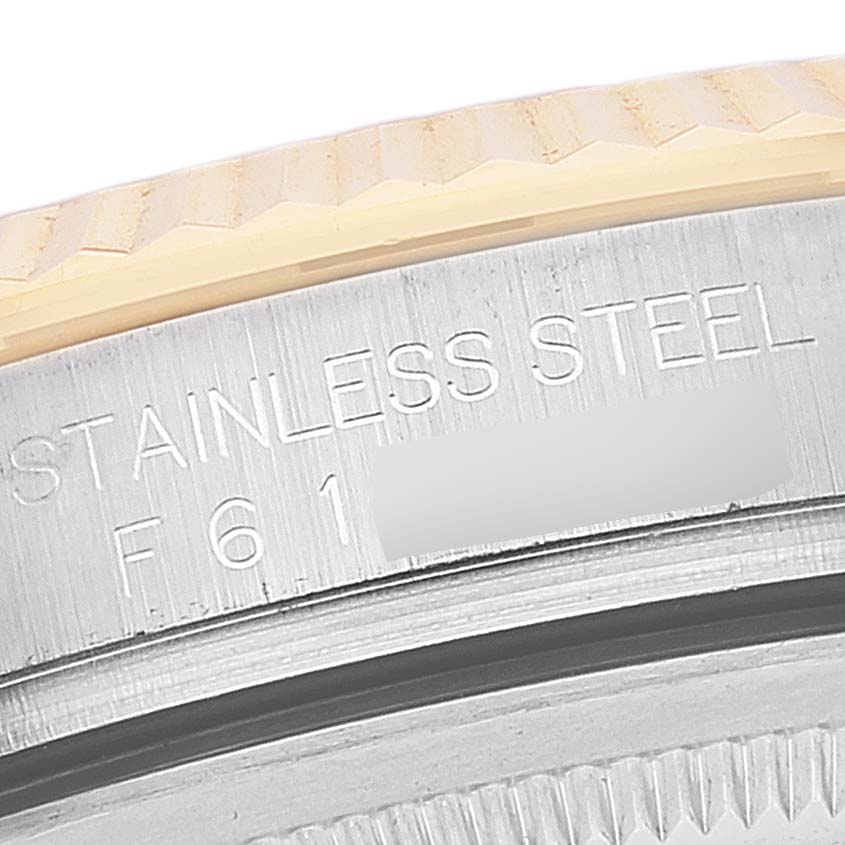 The image shows a close-up angle of the bezel and case of a Rolex Datejust 116233 Men's Steel and Gold (two tone) Beige Dial 116233 Men's Steel and Gold (two tone) Beige Dial watch, highlighting the stainless steel material.