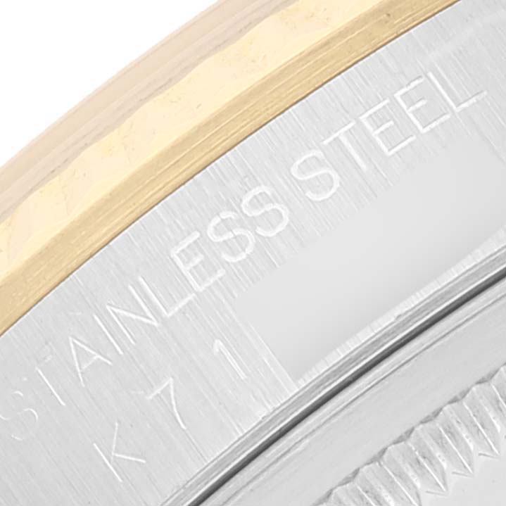 The image shows a close-up of the case back edge of the Rolex Datejust 16233 Men's Steel and Gold (two tone) Silver Dial 16233 Men's Steel and Gold (two tone) Silver Dial, highlighting the text "STAINLESS STEEL" and part of the bezel.