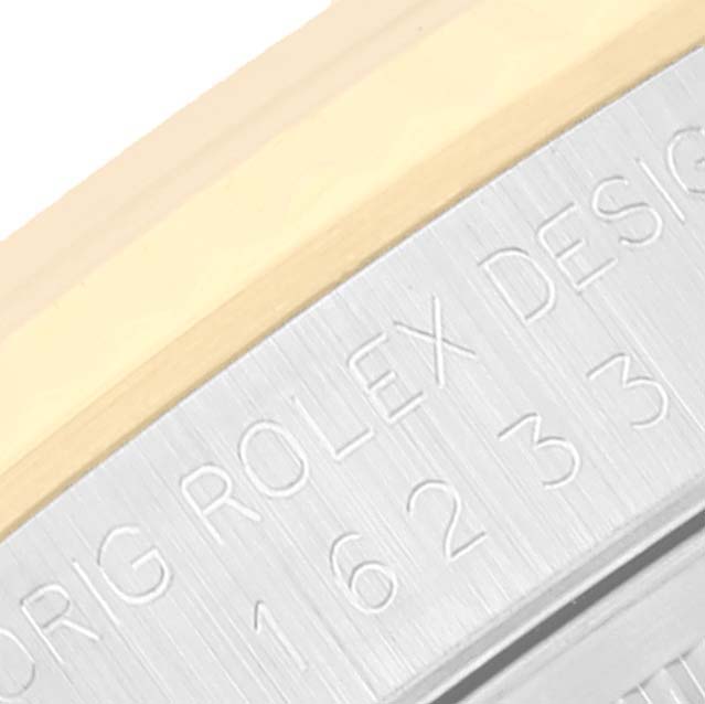 The image shows a close-up of the side case of a Rolex Datejust 16233 Men's Steel and Gold (two tone) White Dial 16233 Men's Steel and Gold (two tone) White Dial watch, highlighting the engraved serial number and the "ORIG ROLEX DESIGN" text.