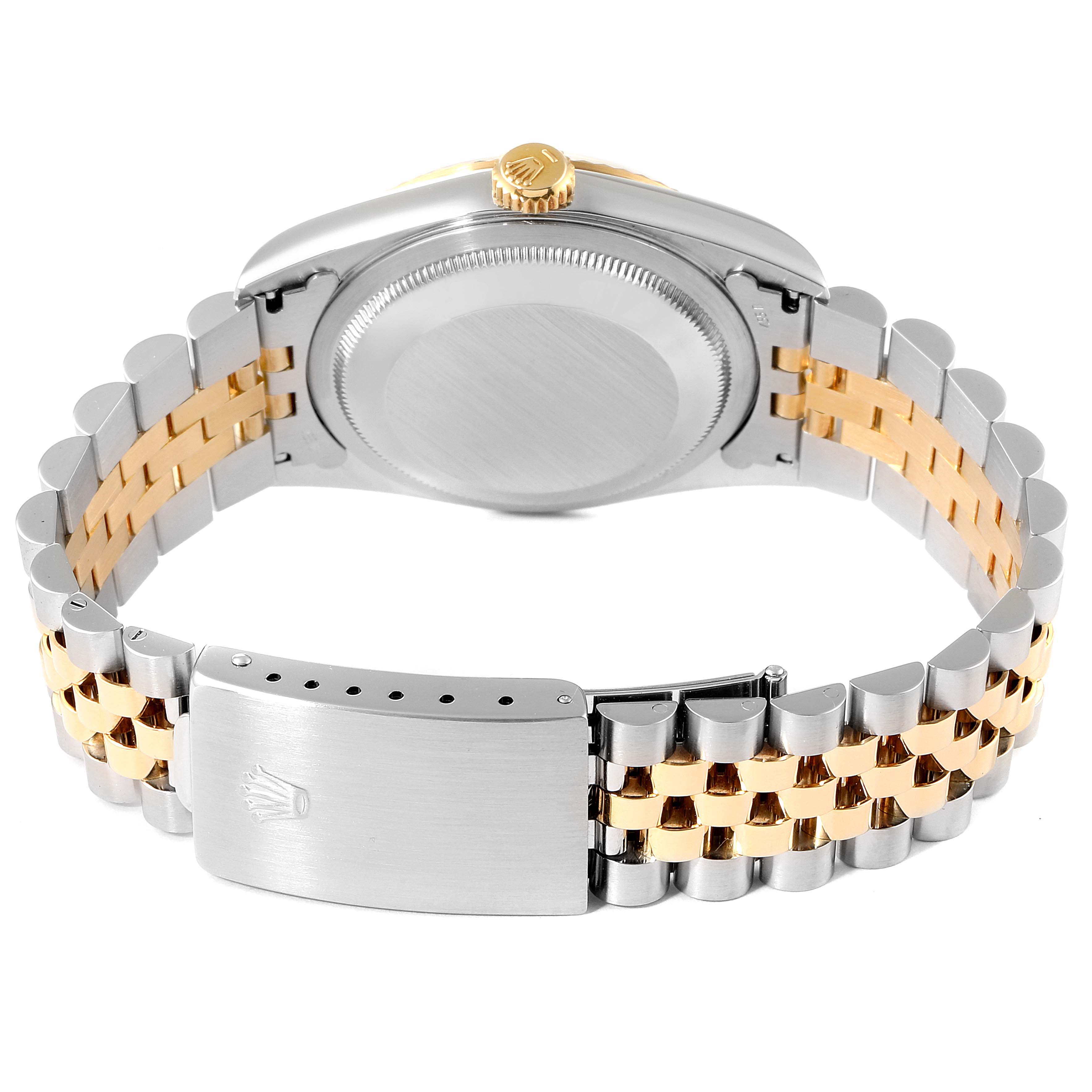 This image shows the back case and clasp of a Rolex Datejust 16233 Men's Steel and Gold (two tone) White Dial 16233 Men's Steel and Gold (two tone) White Dial watch, along with its two-tone metallic bracelet.