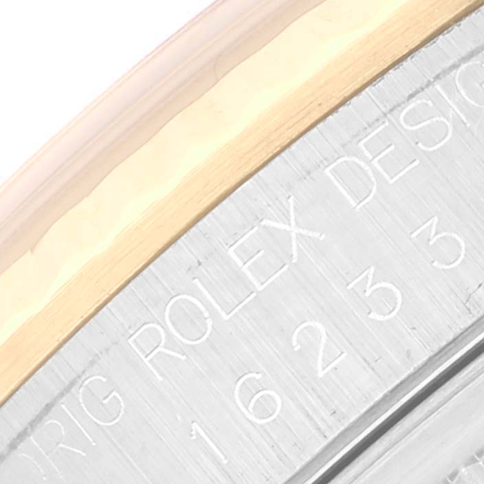 This is a close-up of the engraved edge on the case back of a Rolex Datejust 16233 Men's Steel and Gold (two tone) White Dial 16233 Men's Steel and Gold (two tone) White Dial watch.