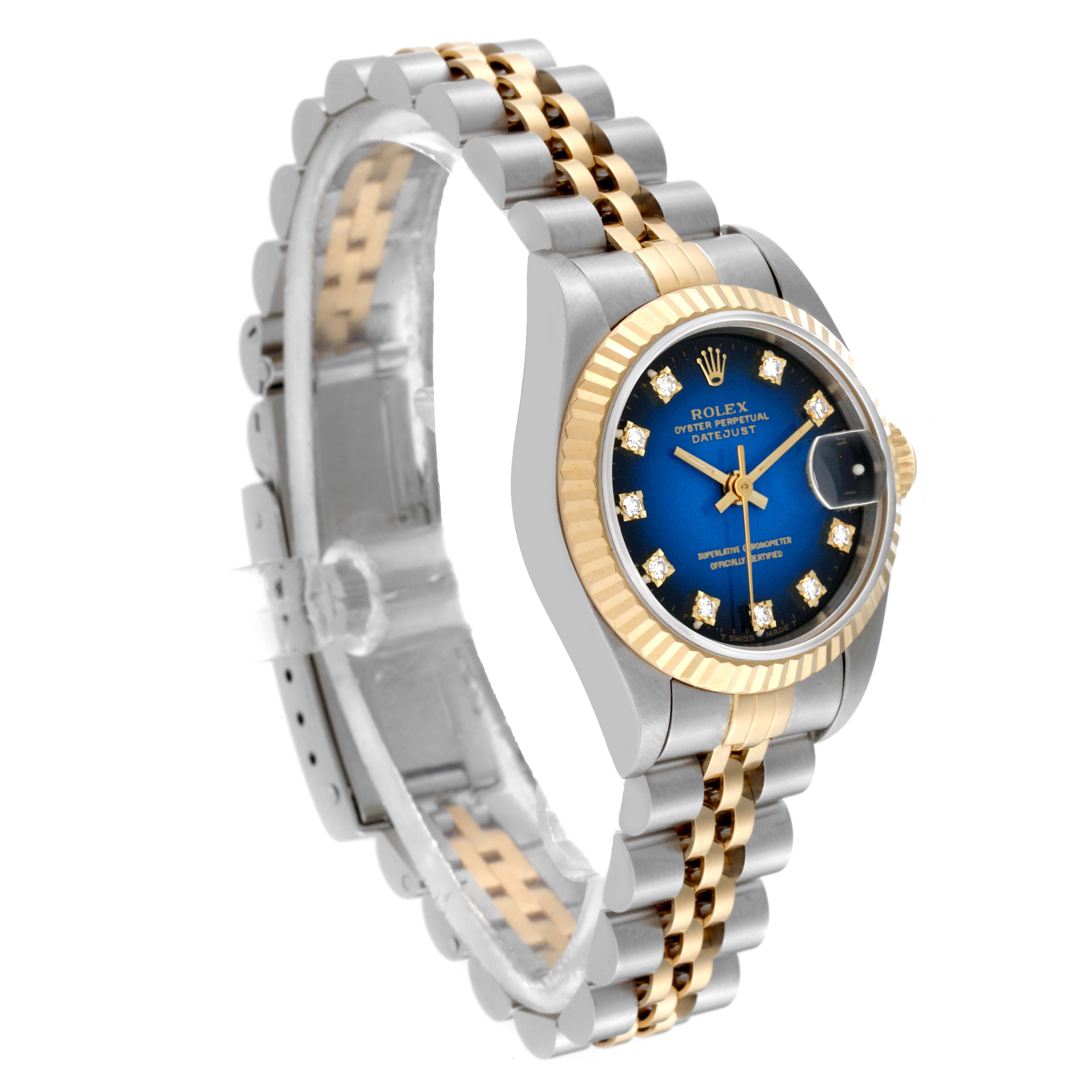 This Rolex Datejust 69173 Women's Steel and Gold (two tone) Blue Dial 69173 Women's Steel and Gold (two tone) Blue Dial watch is shown at an angled view, highlighting its two-tone bracelet, fluted bezel, and blue dial.