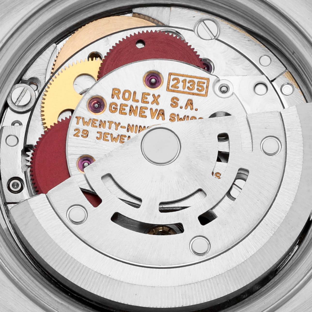 This image shows the internal mechanics and movement of a Rolex Datejust 69173 Women's Steel and Gold (two tone) Blue Dial 69173 Women's Steel and Gold (two tone) Blue Dial watch, highlighting its gears and inscriptions.