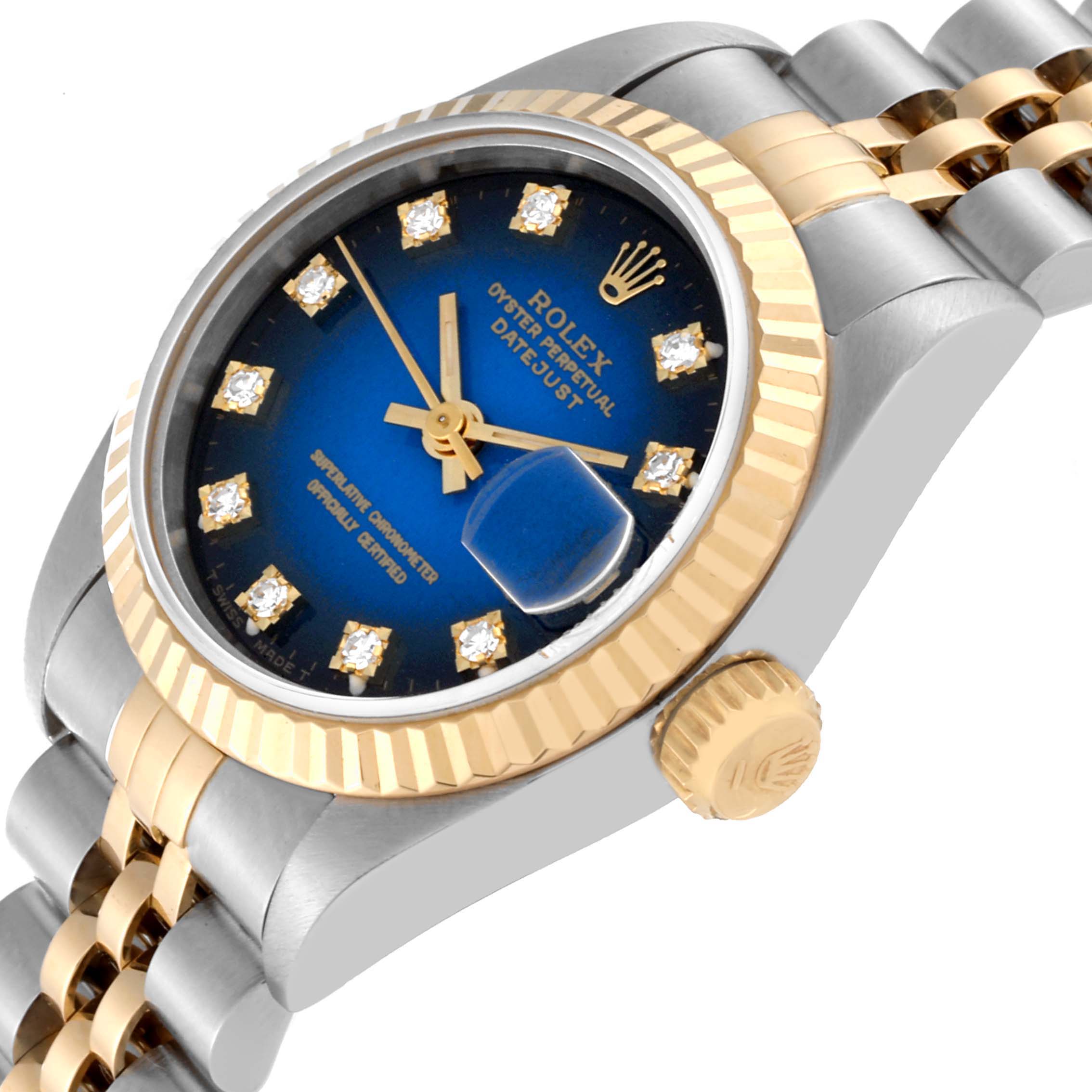 The image shows a side angle of a Rolex Datejust 69173 Women's Steel and Gold (two tone) Blue Dial 69173 Women's Steel and Gold (two tone) Blue Dial watch, highlighting its blue dial, fluted bezel, and two-tone bracelet.