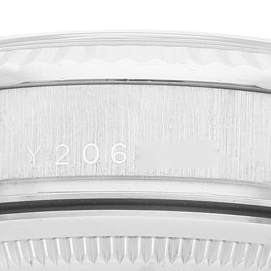 The image shows a close-up view of the serial number on the side of a Rolex President 118239 Men's White Gold Silver Dial 118239 Men's White Gold Silver Dial model's case.
