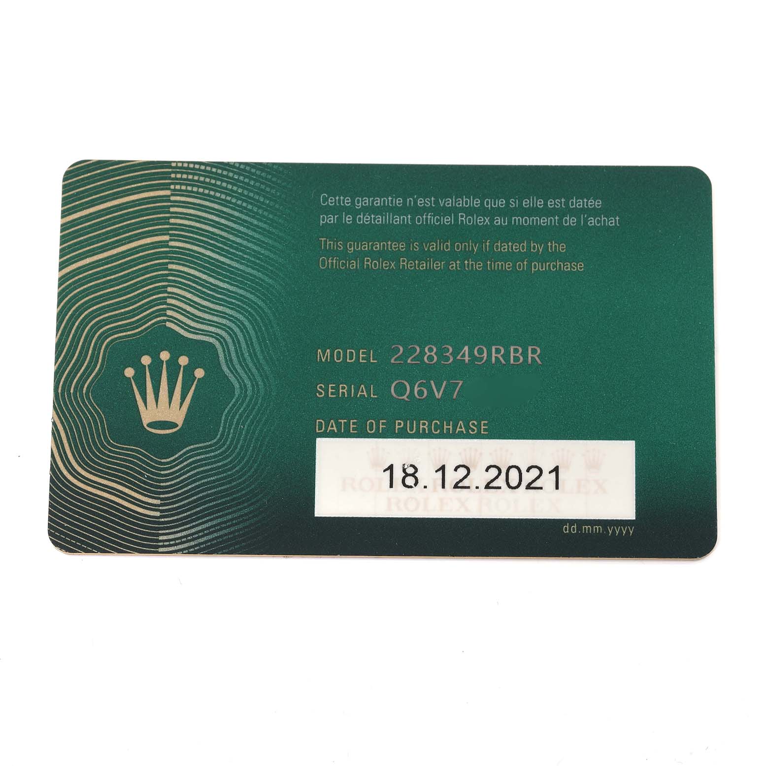The image shows a warranty card for a Rolex President 228349RBR Men's White Gold Green Dial 228349RBR Men's White Gold Green Dial model 228349RBR, including its serial number and purchase date.