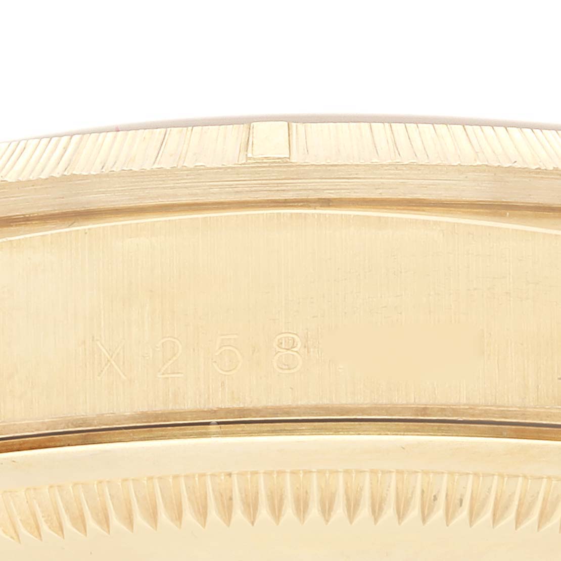 The image shows a close-up of the side view of the case with crown and serial number of a Rolex President 18248 Men
s Yellow Gold Champagne Dial 18248 Men
s Yellow Gold Champagne Dial model.