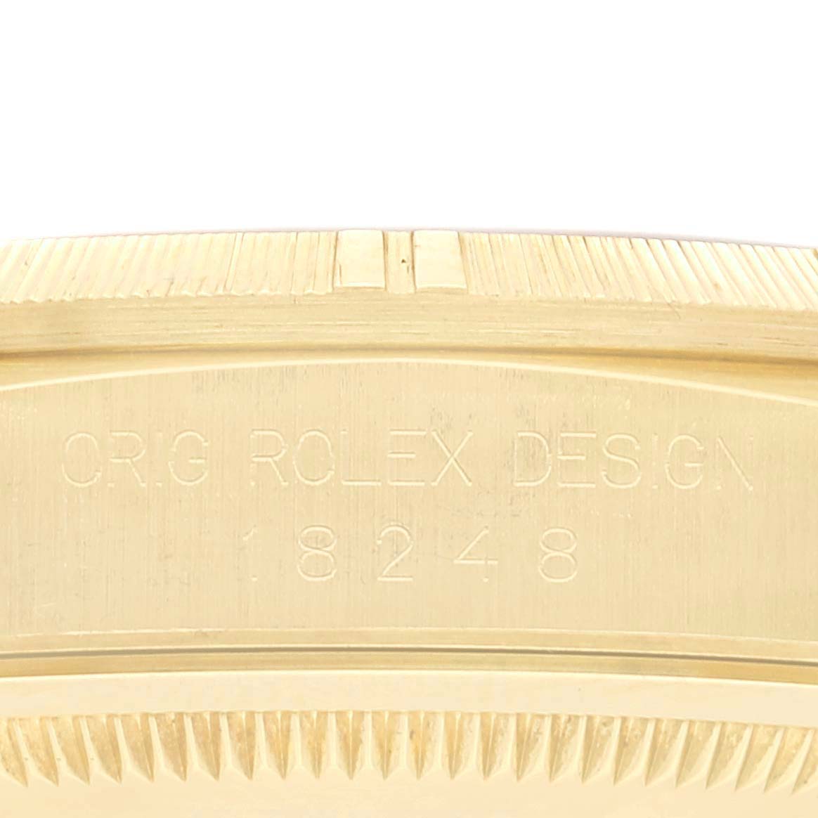 This image shows an engraved side of a Rolex President 18248 Men
s Yellow Gold Champagne Dial 18248 Men
s Yellow Gold Champagne Dial model, displaying the model number 18248 and brand name.