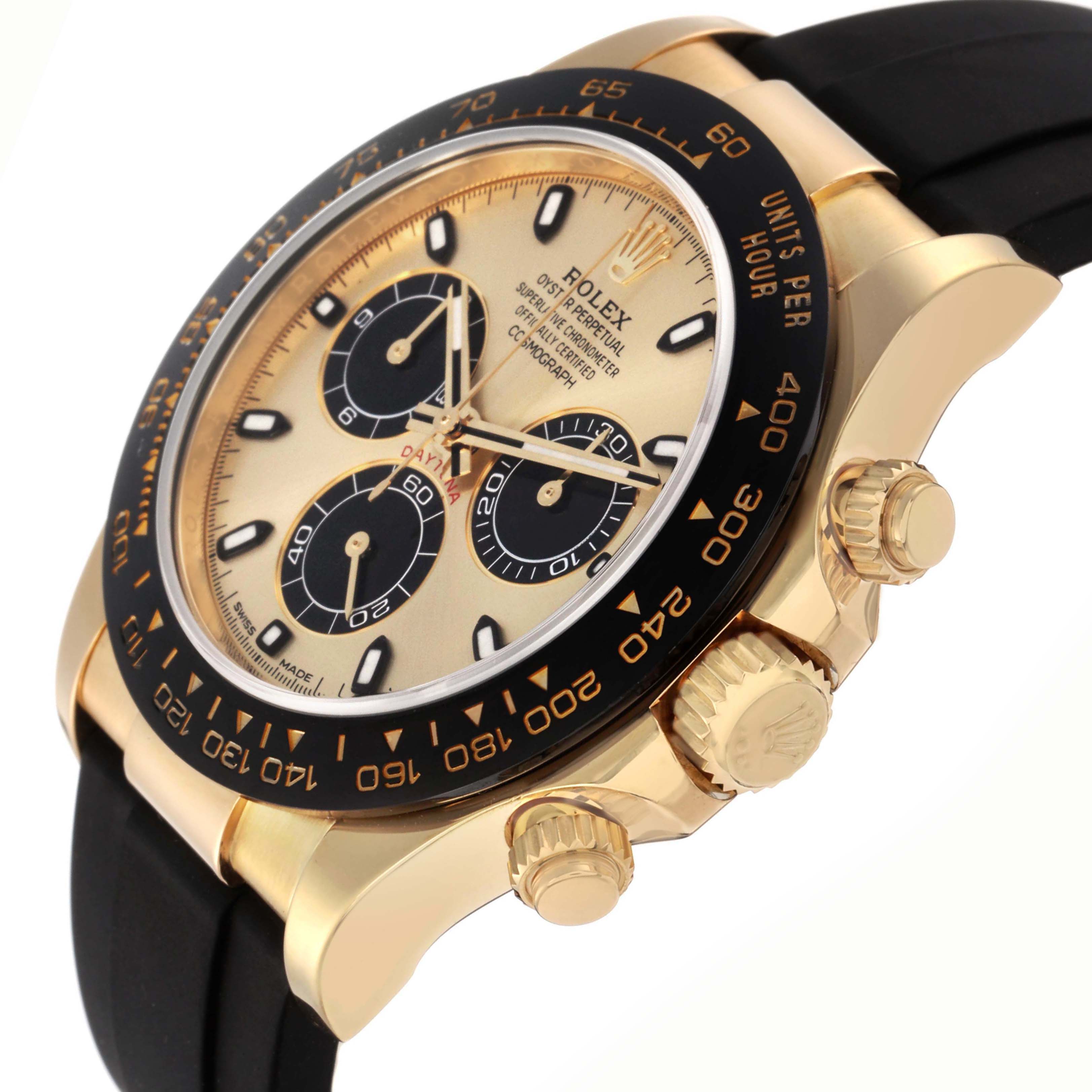 The image shows a side angle of a Rolex Daytona 73019 Men
s Yellow Gold Champagne Dial, displaying the watch face, bezel, and crown with a black strap.