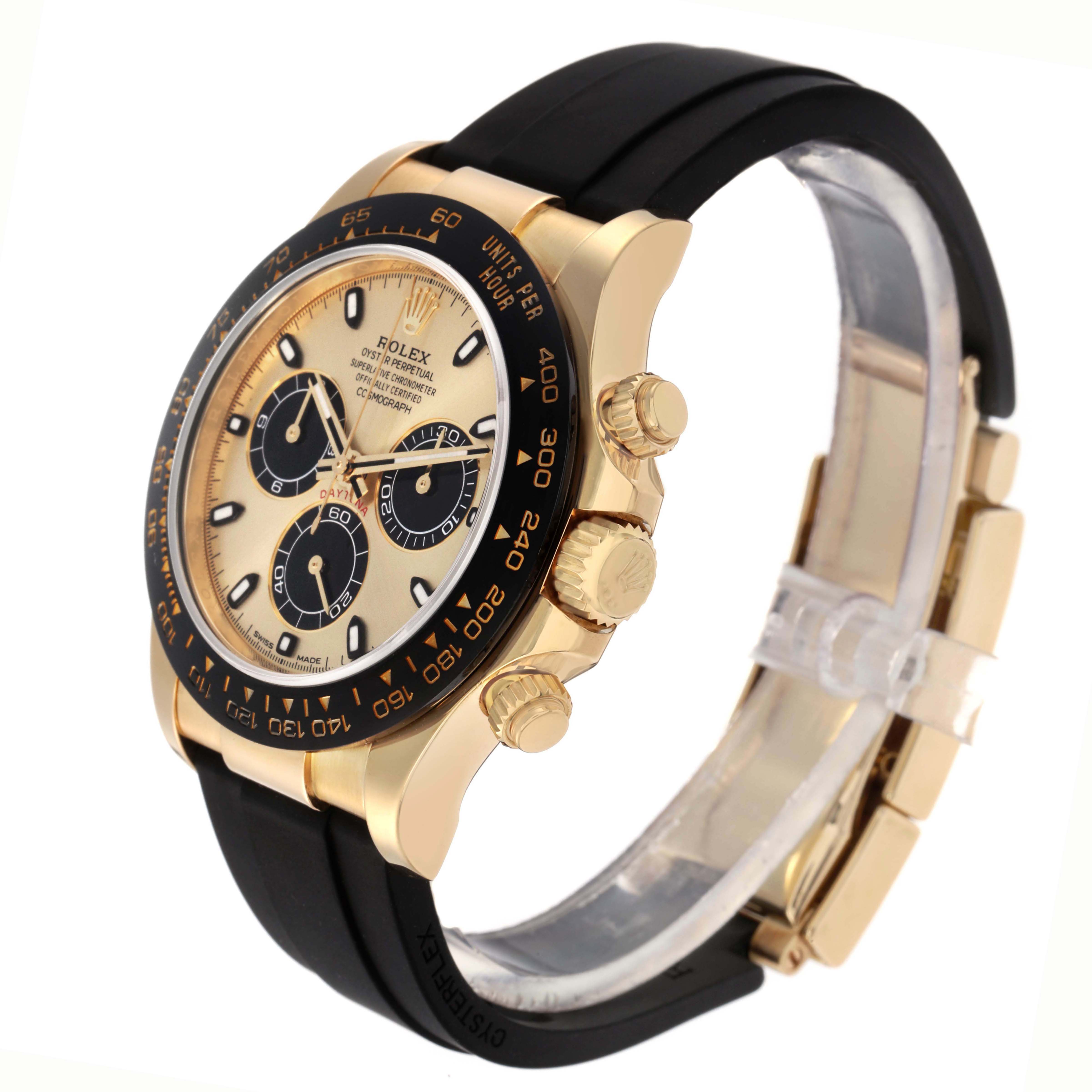 The Rolex Daytona 73019 Men
s Yellow Gold Champagne Dial watch is shown at a side angle, highlighting the face, bezel, pushers, and black strap.