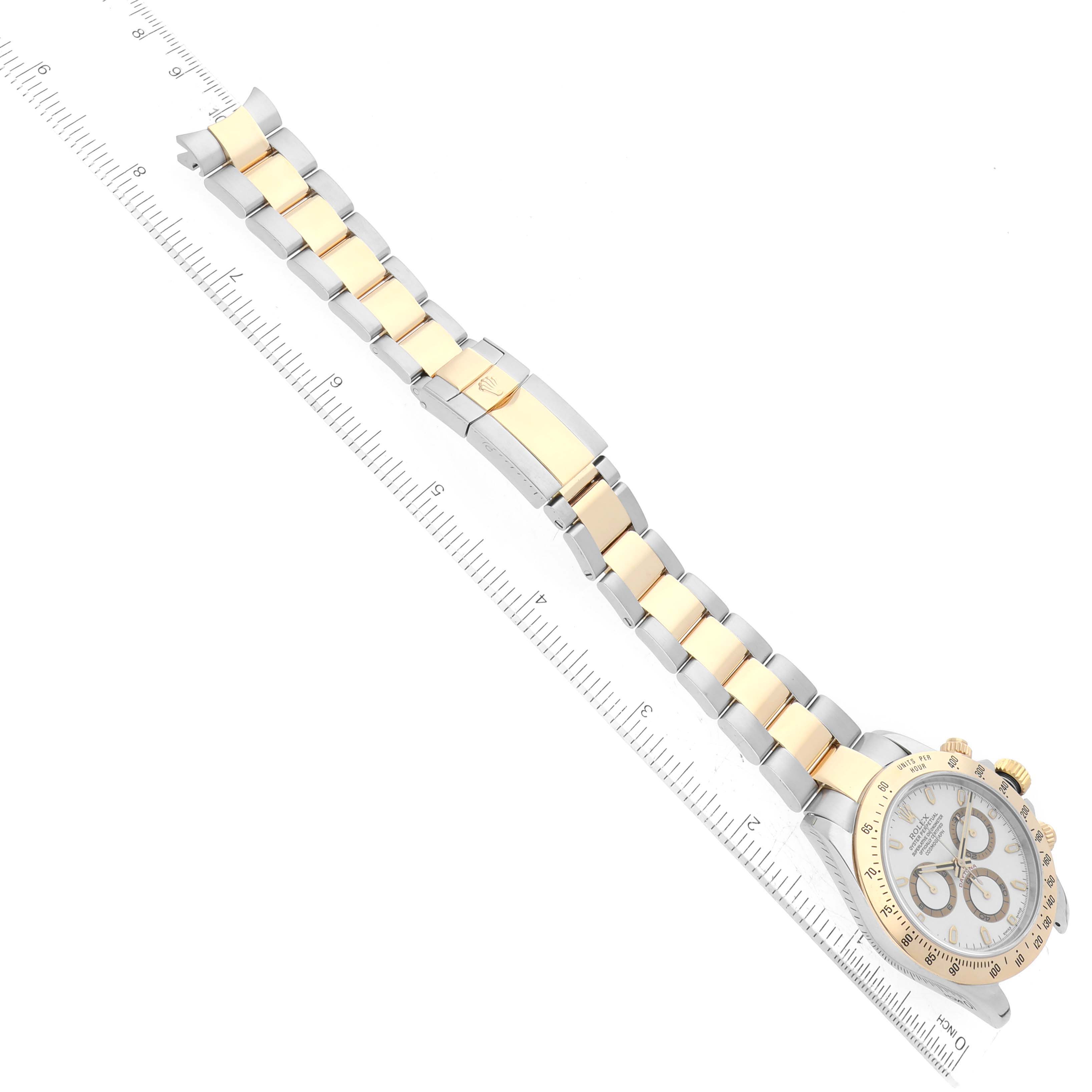 The image shows a top-down view of a Rolex Daytona 116523 Men's Steel and Gold (two tone) White Dial 116523 Men's Steel and Gold (two tone) White Dial watch, highlighting its two-tone bracelet and clasp.