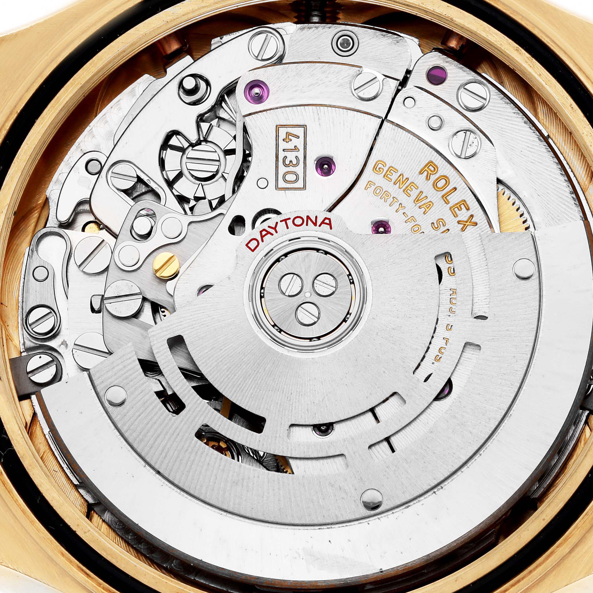This image shows the movement of a Rolex Daytona 116518LN Men
s Yellow Gold Champagne Dial watch with visible gears, rotor, and engraved markings, viewed from the back.