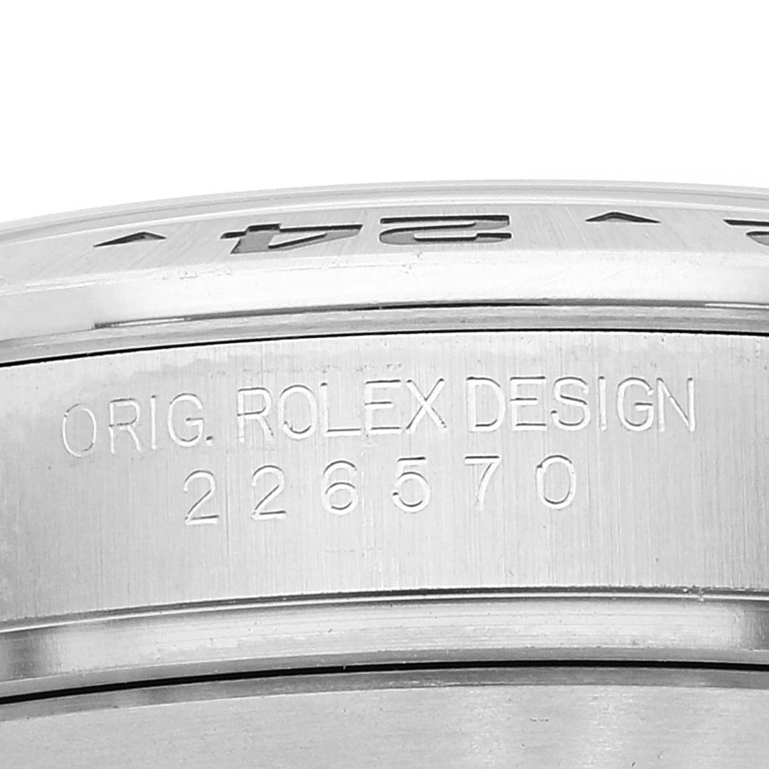 The image shows a close-up of the side of a Rolex Explorer 226570 Men
s Stainless Steel White Dial 226570 Men
s Stainless Steel White Dial model watch case with the engraved design and model number.