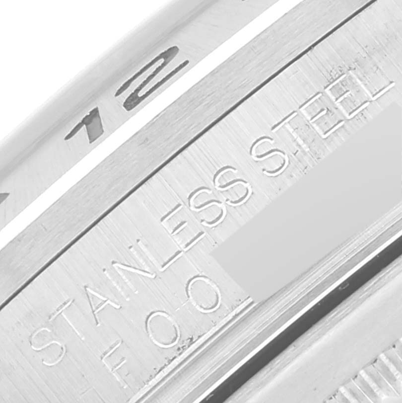 The image shows a close-up of the side and part of the bezel, displaying "STAINLESS STEEL" and the engraved numbers of the Rolex Explorer 16570 Men's Stainless Steel Black Dial 16570 Men's Stainless Steel Black Dial.