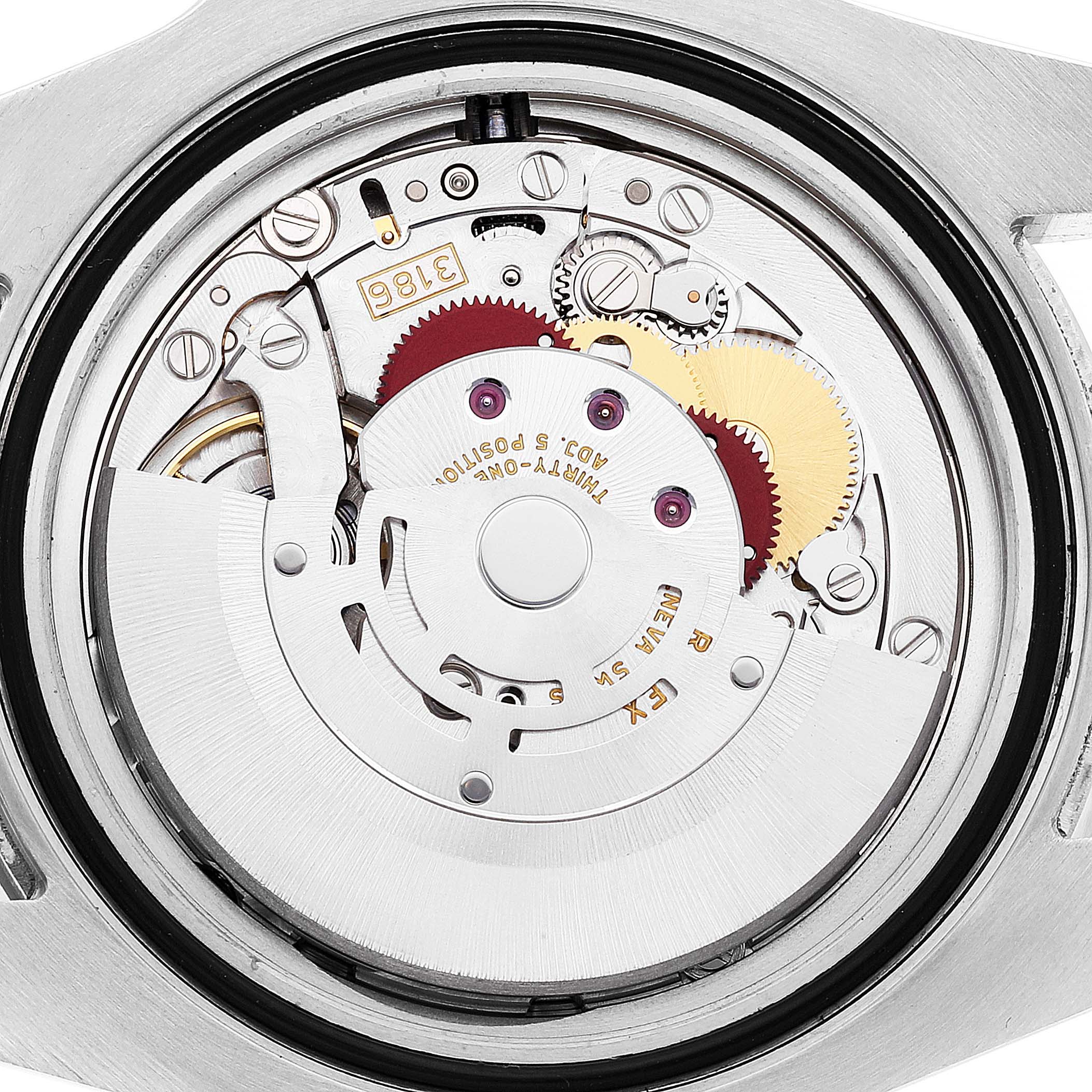 The image shows the movement mechanism of a Rolex GMT-Master 116710 Men
s Stainless Steel Black Dial 116710 Men
s Stainless Steel Black Dial watch from a rear view, highlighting gears and intricate components.