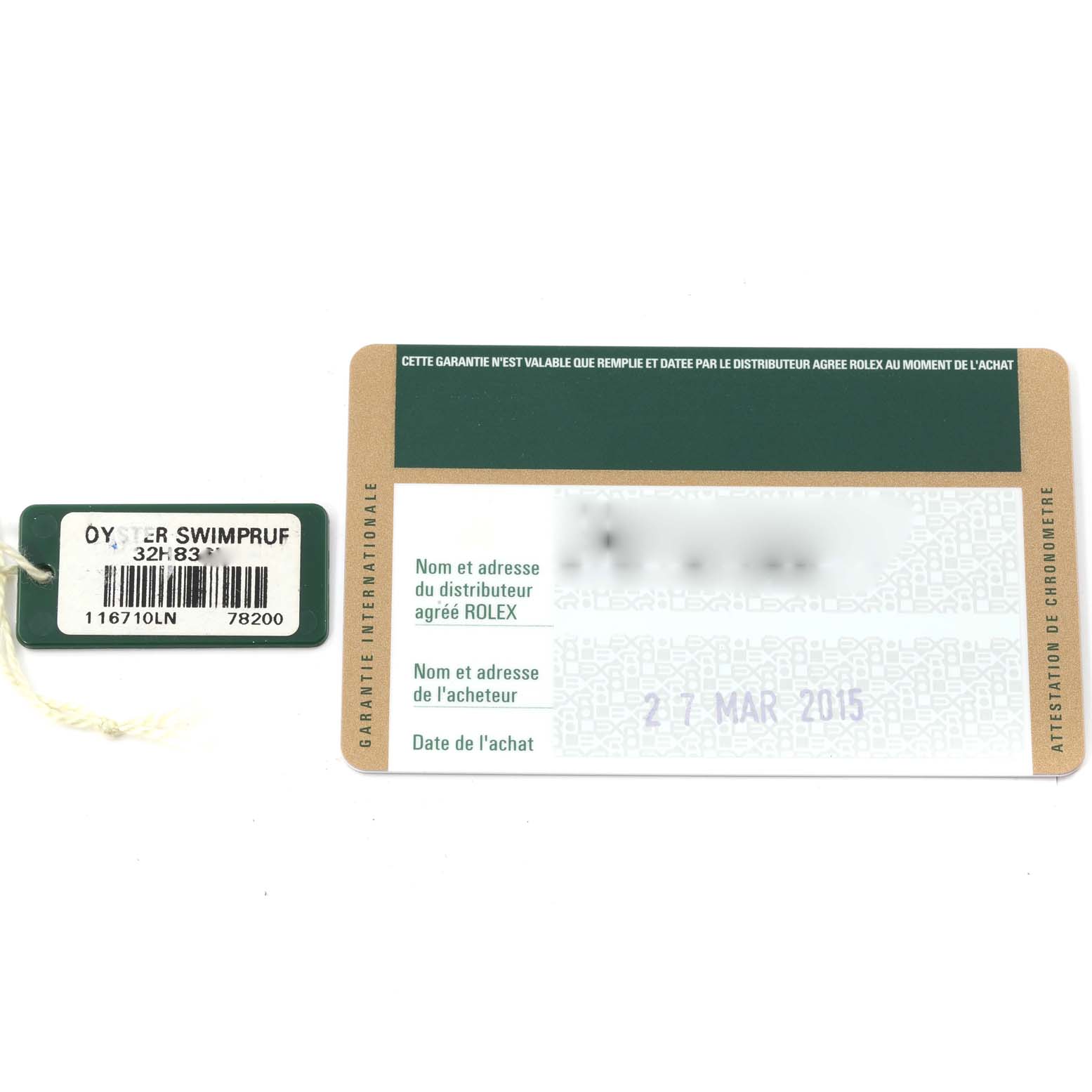 This image shows the warranty card and tag for a Rolex GMT-Master 116710 Men
s Stainless Steel Black Dial 116710 Men
s Stainless Steel Black Dial watch, photographed from above.