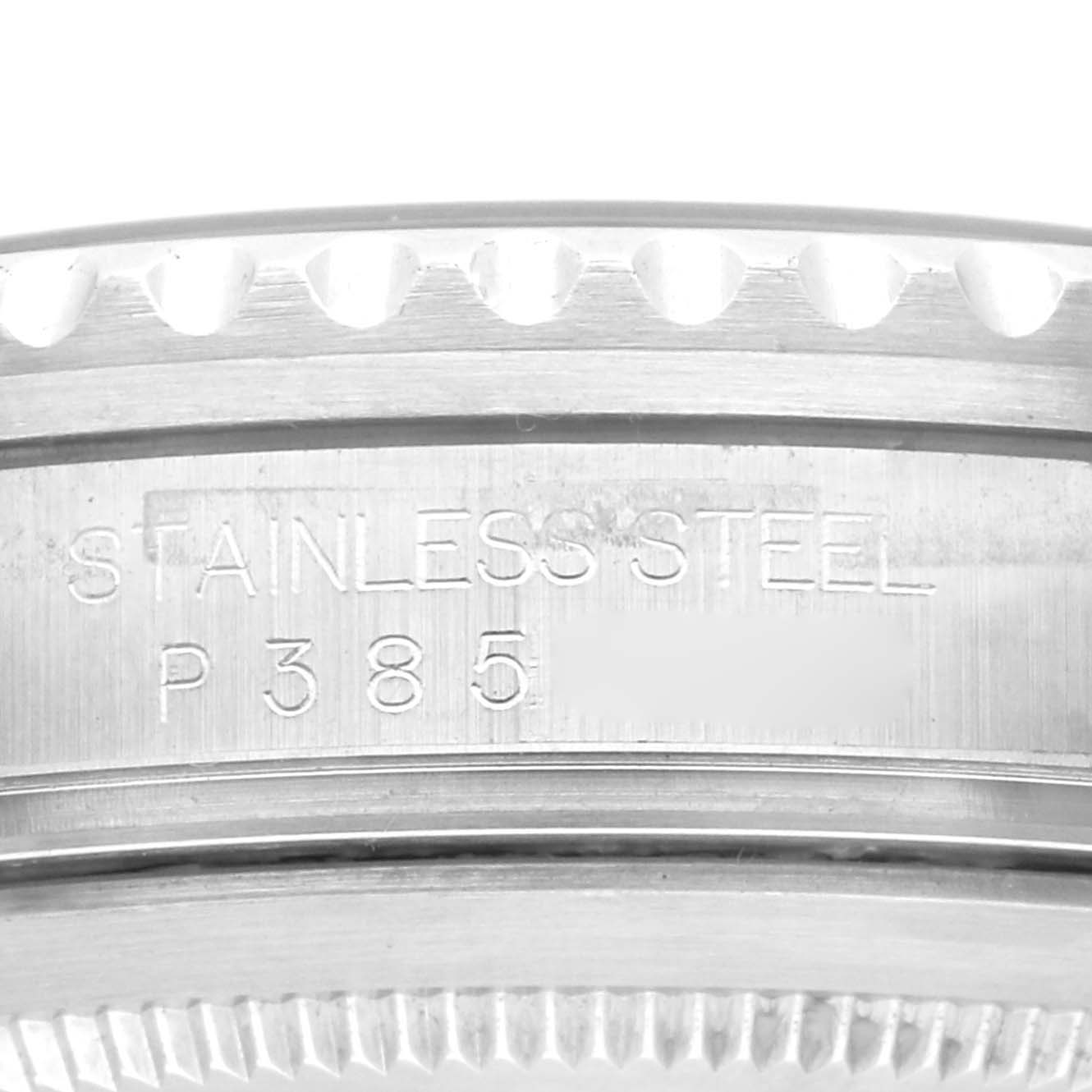 The image shows a close-up of the edge and case back of a Rolex GMT-Master 16710 Men
s Stainless Steel Black Dial 16710 Men
s Stainless Steel Black Dial watch, highlighting the engraved text.