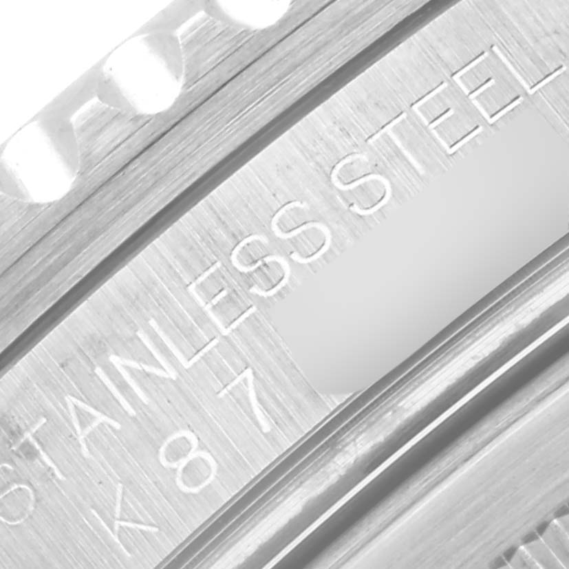 This close-up image shows the stainless steel bezel and part of the caseback of a Rolex GMT-Master 16710 Men's Stainless Steel Black Dial 16710 Men's Stainless Steel Black Dial watch.