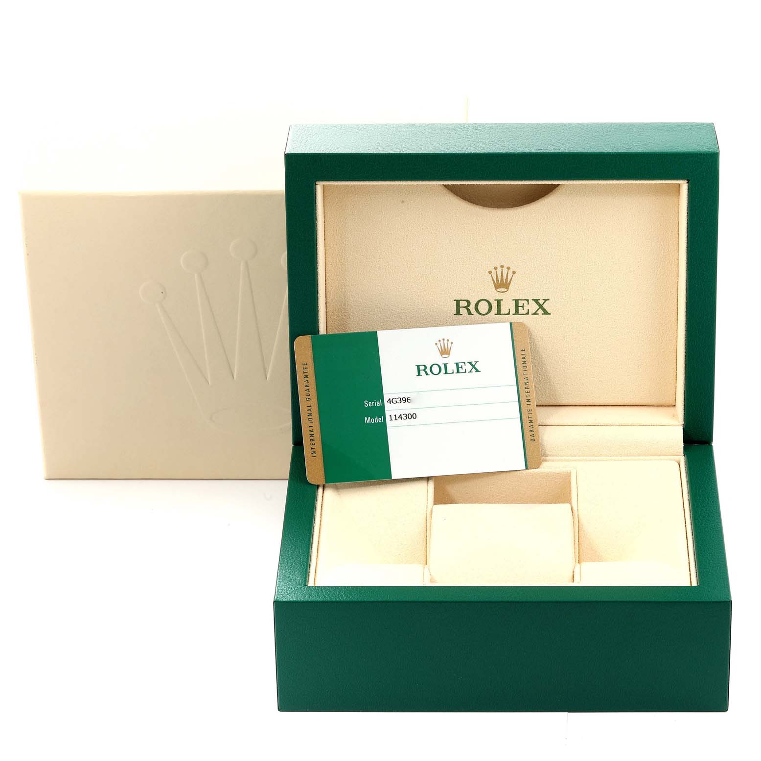 The image shows a Rolex Oyster Perpetual 114300 Men's Stainless Steel Blue Dial 114300 Men's Stainless Steel Blue Dial watch box, documentation, and interior compartments, viewed from the front.