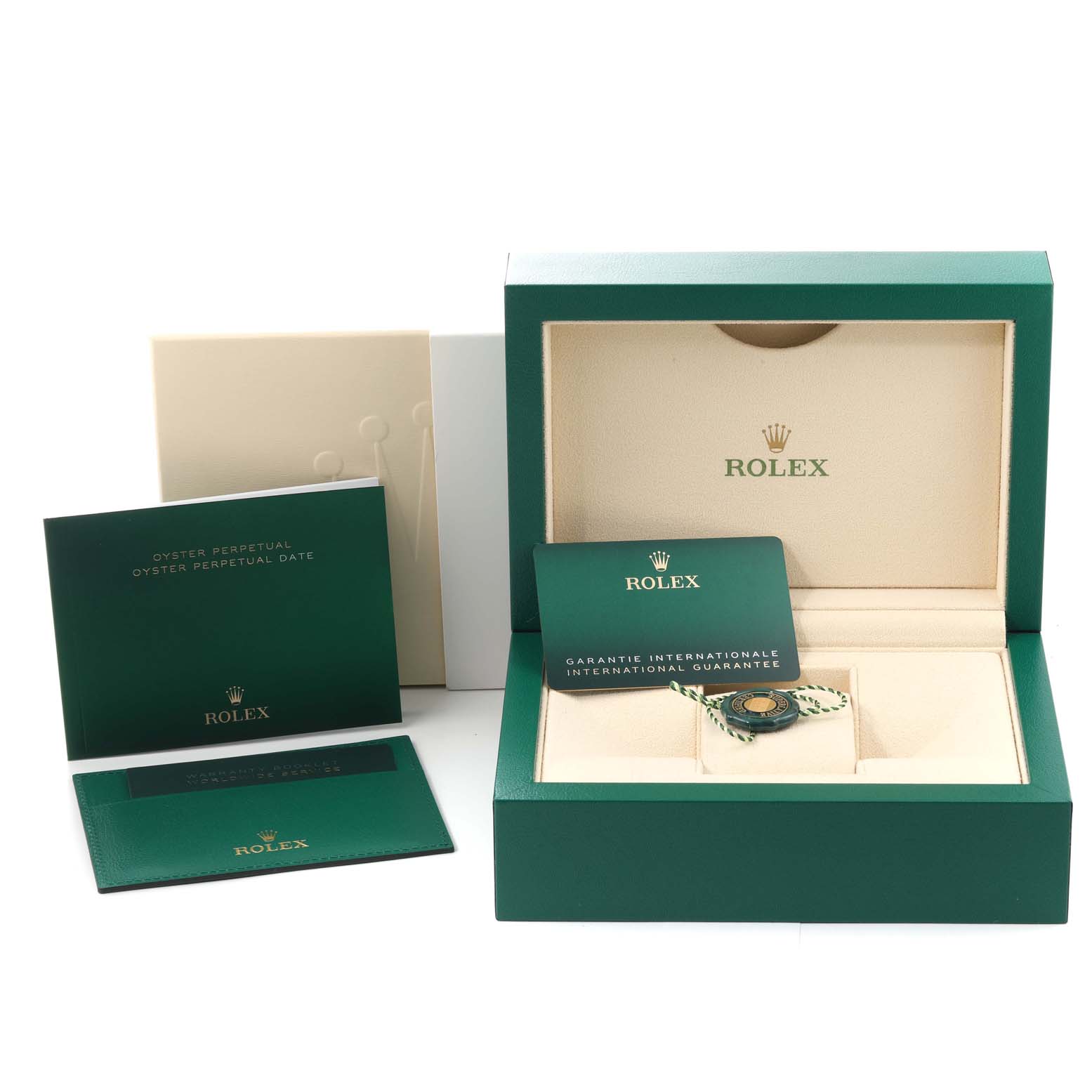 The image shows the box and accessories for a Rolex Oyster Perpetual 126000 Men
s Stainless Steel Blue Dial 126000 Men
s Stainless Steel Blue Dial watch, including guarantee cards and manuals.