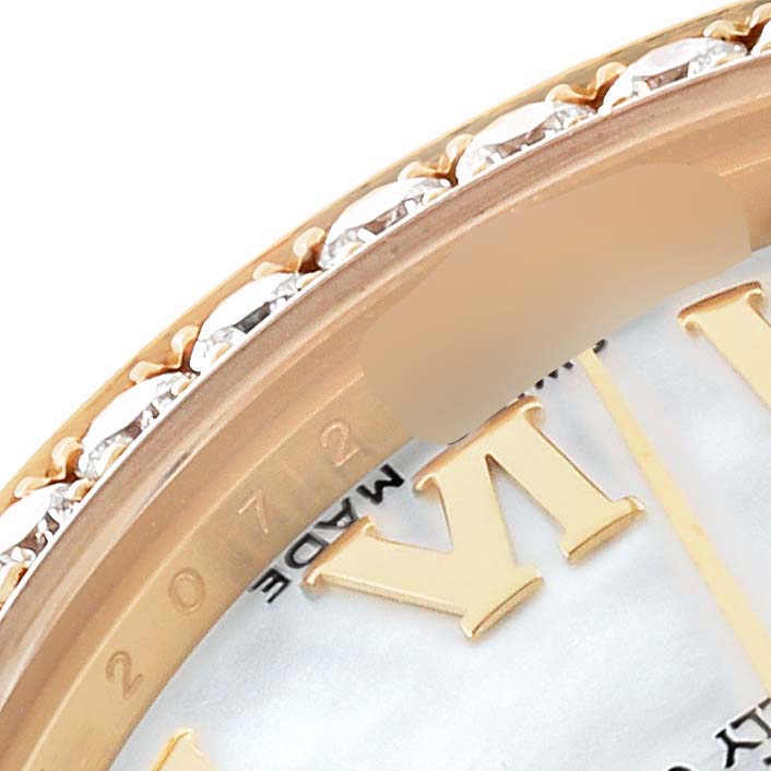 This close-up image shows part of the dial and diamond-encrusted bezel of the Rolex President 178288 Women's Yellow Gold Champagne Dial 178288 Women's Yellow Gold Champagne Dial model watch.