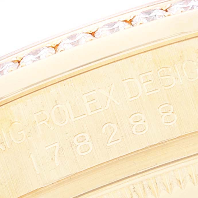 Close-up view of the engraved side edge of the Rolex President 178288 Women's Yellow Gold Champagne Dial 178288 Women's Yellow Gold Champagne Dial model watch with visible serial number.
