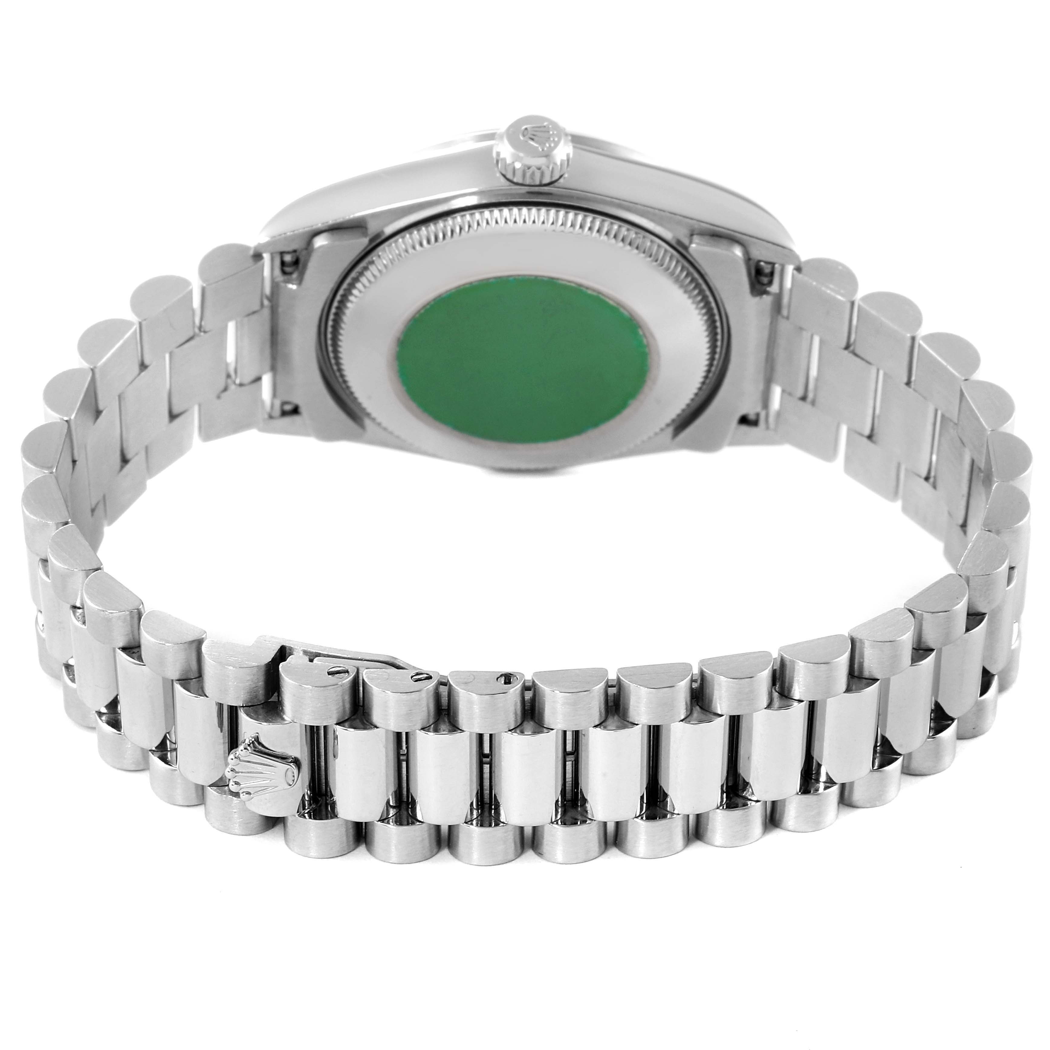 The image shows the back view of a Rolex President 78246 Women
s Platinum Silver Dial 78246 Women
s Platinum Silver Dial model watch, highlighting its clasp and metal bracelet.