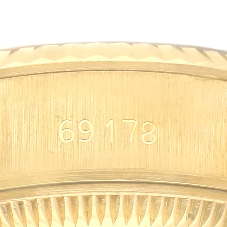 The image shows a close-up of the side of the Rolex President 69178 Women's Yellow Gold Champagne Dial 69178 Women's Yellow Gold Champagne Dial watch case with the model number "69178" engraved.