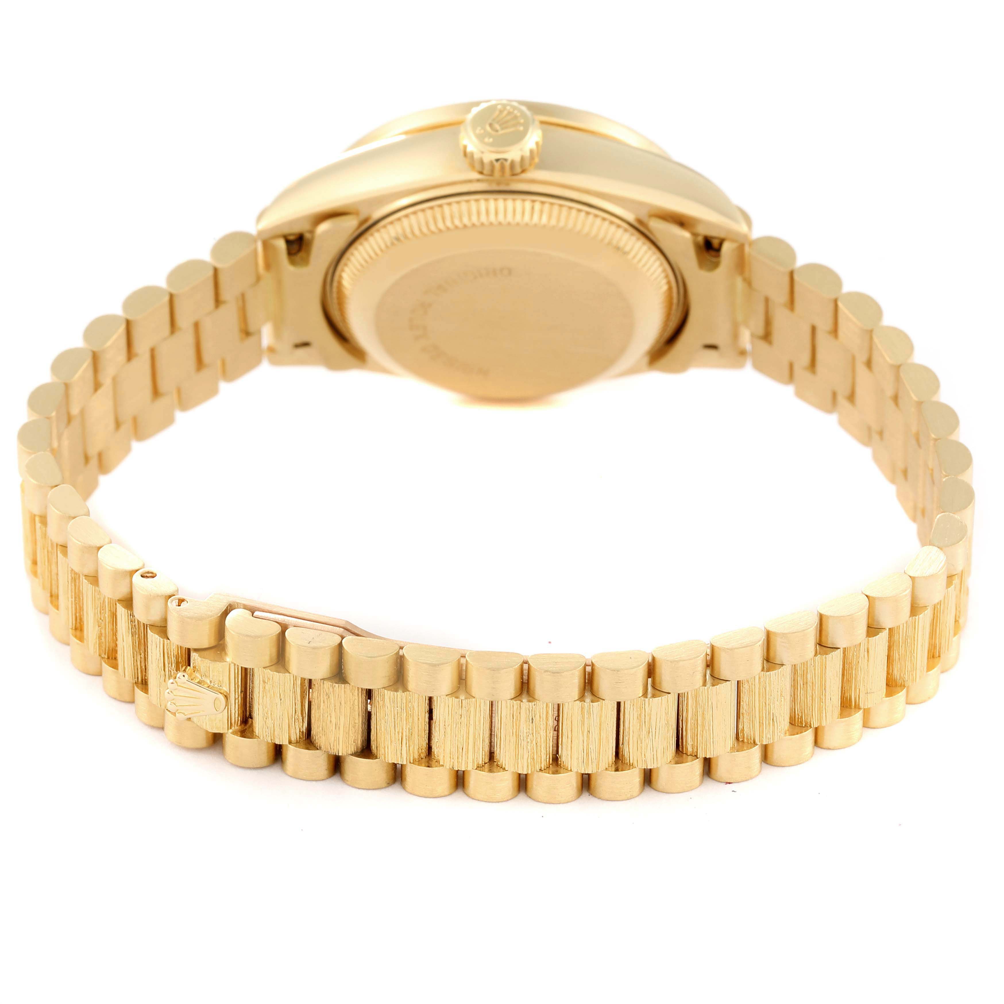 This image shows the back view and bracelet of a Rolex President 69288 Women's Yellow Gold Champagne Dial 69288 Women's Yellow Gold Champagne Dial model watch.