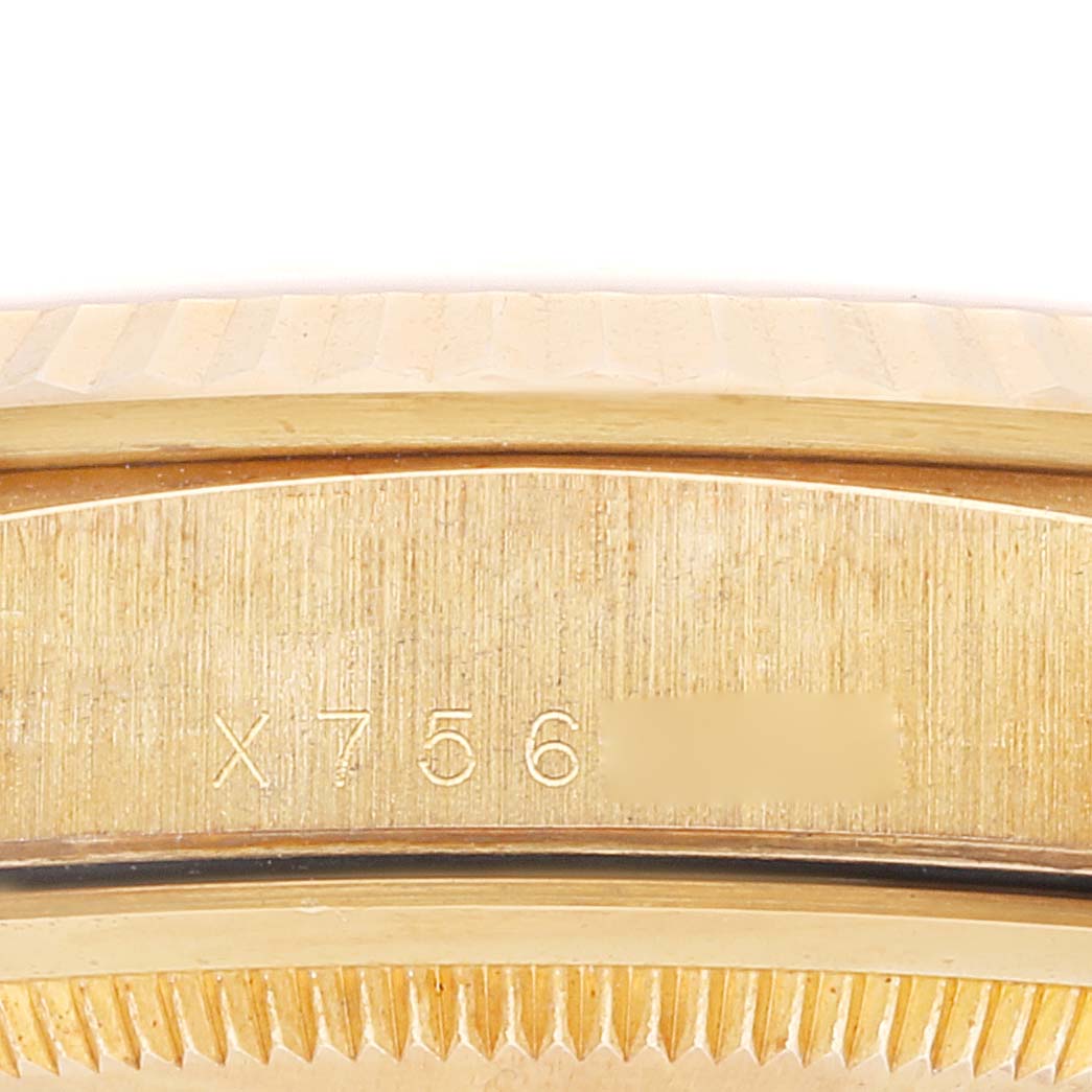 The image shows a close-up of the case with serial number engraving for a Rolex President 18238 Men
s Yellow Gold Champagne Dial 18238 Men
s Yellow Gold Champagne Dial model watch.