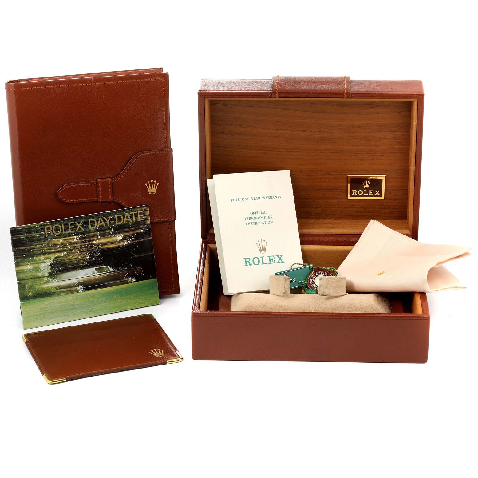 The image shows the packaging and accessories for a Rolex President 18238 Men
s Yellow Gold Champagne Dial 18238 Men
s Yellow Gold Champagne Dial model, including a box, booklets, and tags.
