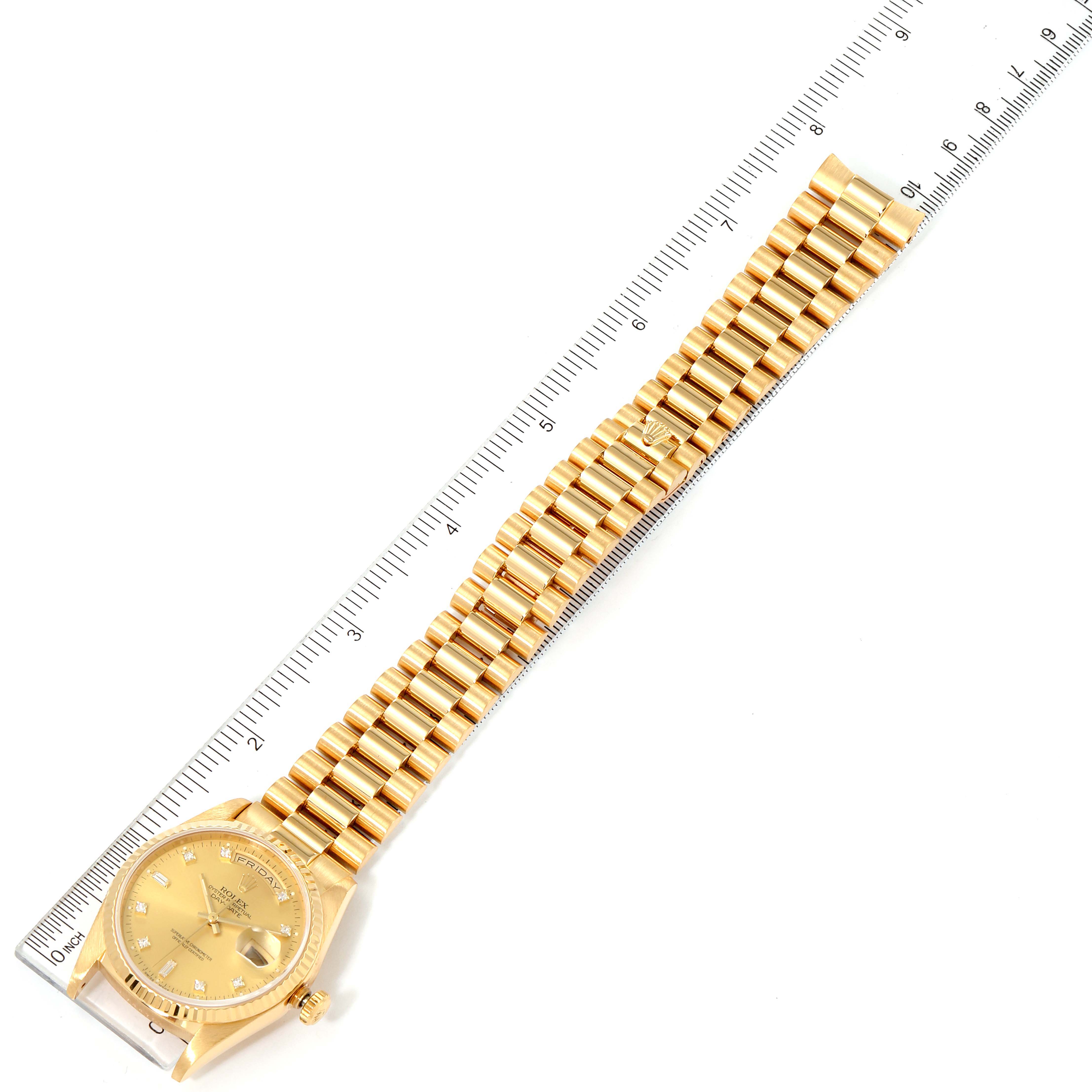 A Rolex President 18238 Men
s Yellow Gold Champagne Dial 18238 Men
s Yellow Gold Champagne Dial model watch is shown flat with its golden bracelet laid out next to a measuring ruler.