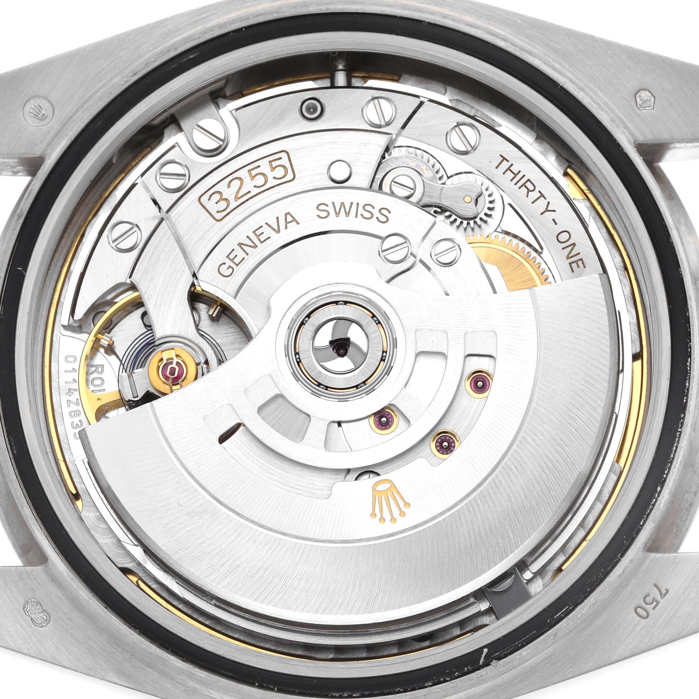 This image shows the movement mechanism of a Rolex President 228239 Men's White Gold Green Dial 228239 Men's White Gold Green Dial model, featuring gears, rotors, and inscriptions including "3255" and "GENEVA SWISS."