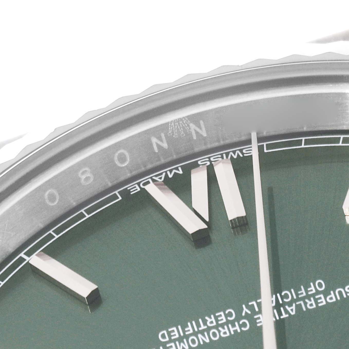 This image shows a close-up of the Rolex President 228239 Men's White Gold Green Dial 228239 Men's White Gold Green Dial model watch, highlighting the bezel, markers, and part of the face.
