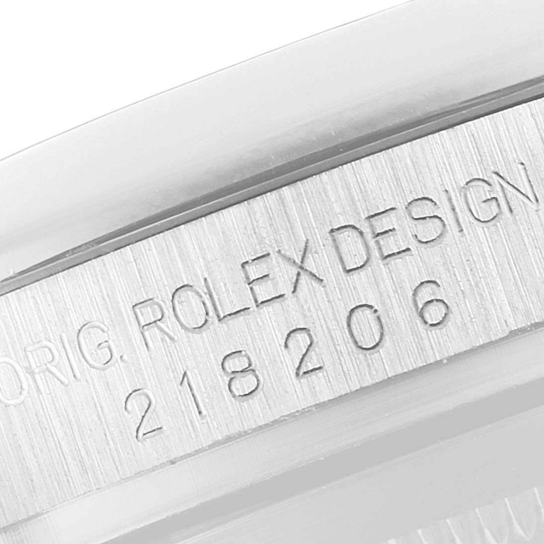 This close-up image features the side engraving of the Rolex President 218206 Men's Platinum Blue Dial 218206 Men's Platinum Blue Dial model watch case.