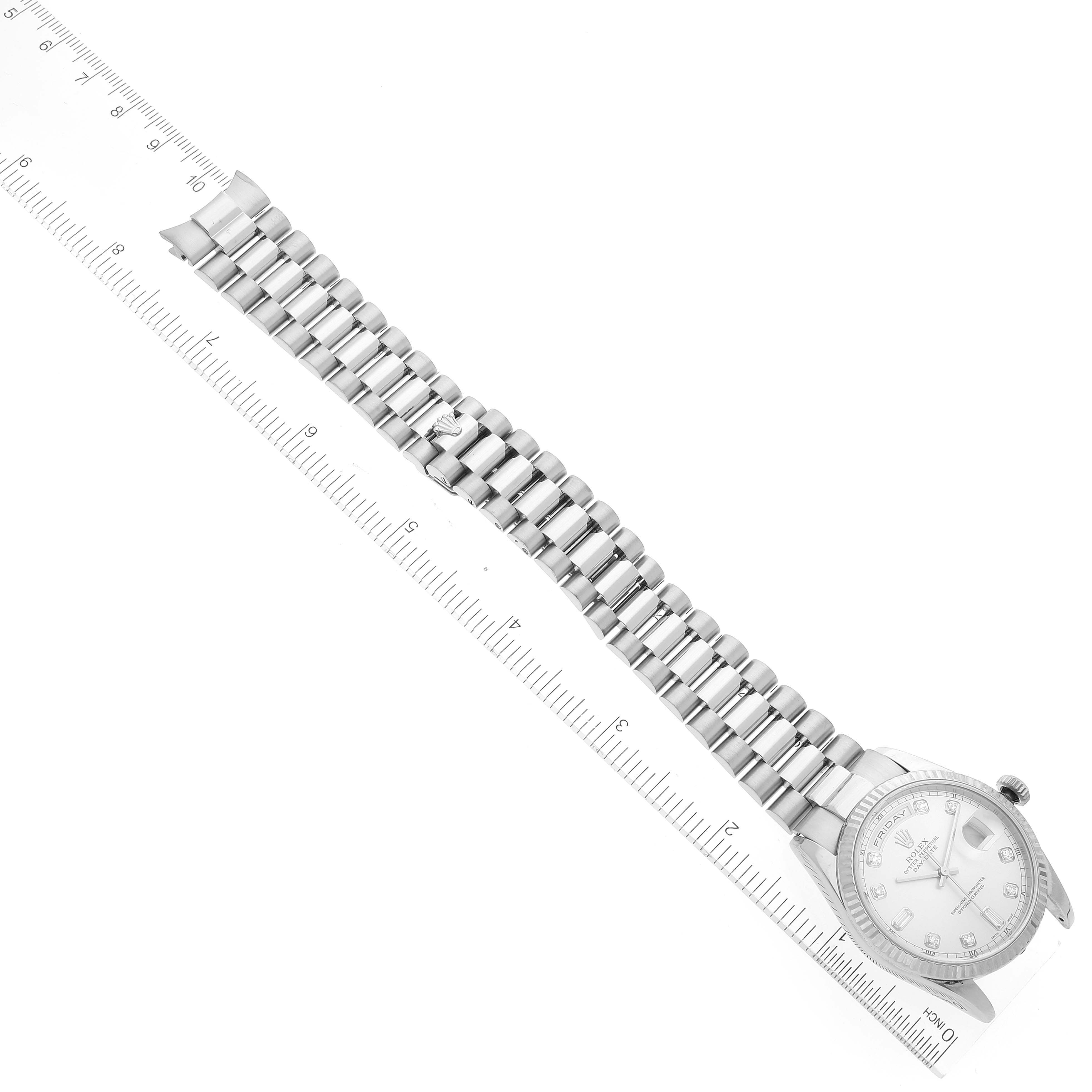 The image shows a Rolex President 118239 Men's Stainless Steel Silver Dial 118239 Men's Stainless Steel Silver Dial model watch laid flat with its full bracelet and face visible along a ruler for scale.