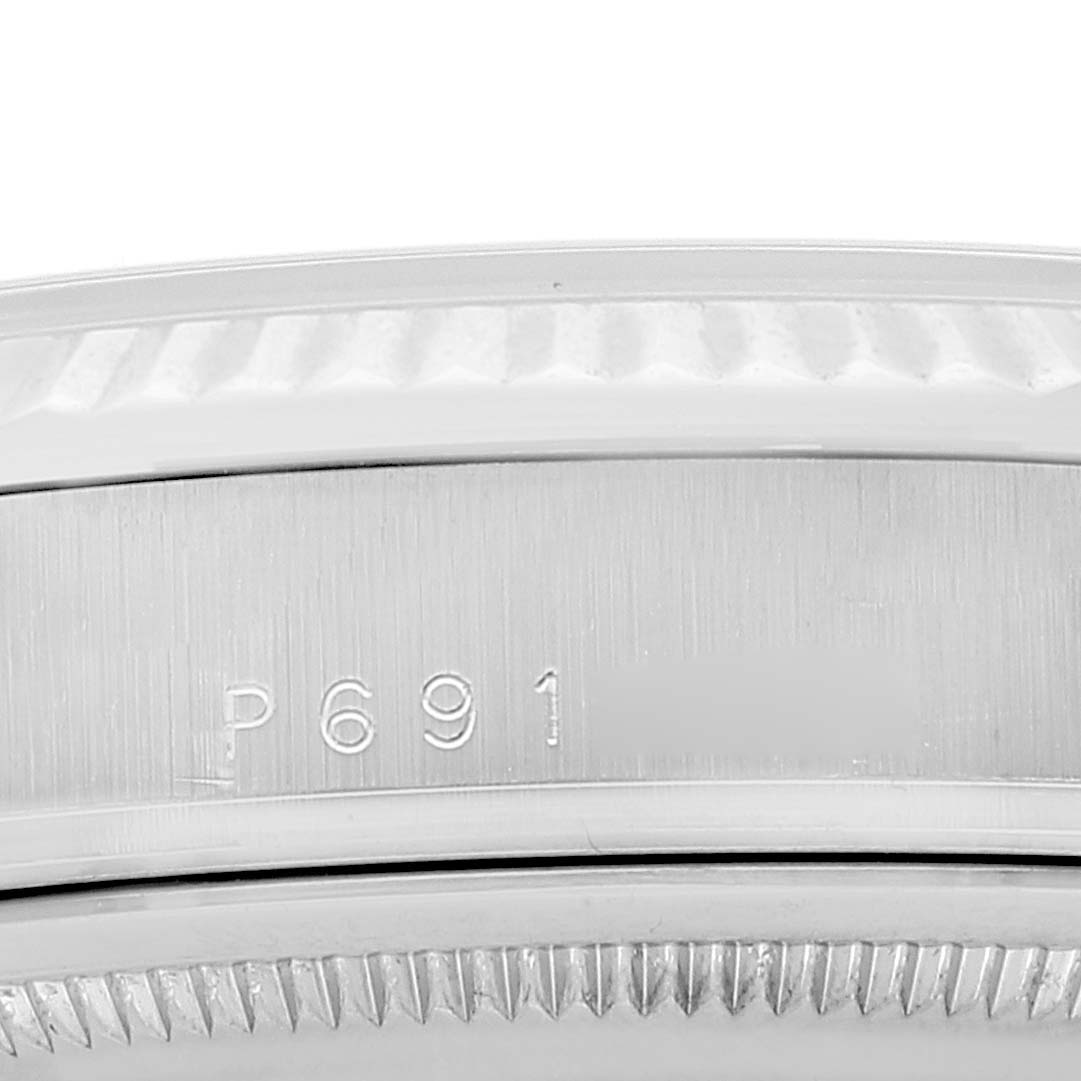 The image shows a close-up of the side case with an engraved serial number on a Rolex President 118239 Men's Stainless Steel Silver Dial 118239 Men's Stainless Steel Silver Dial model watch.