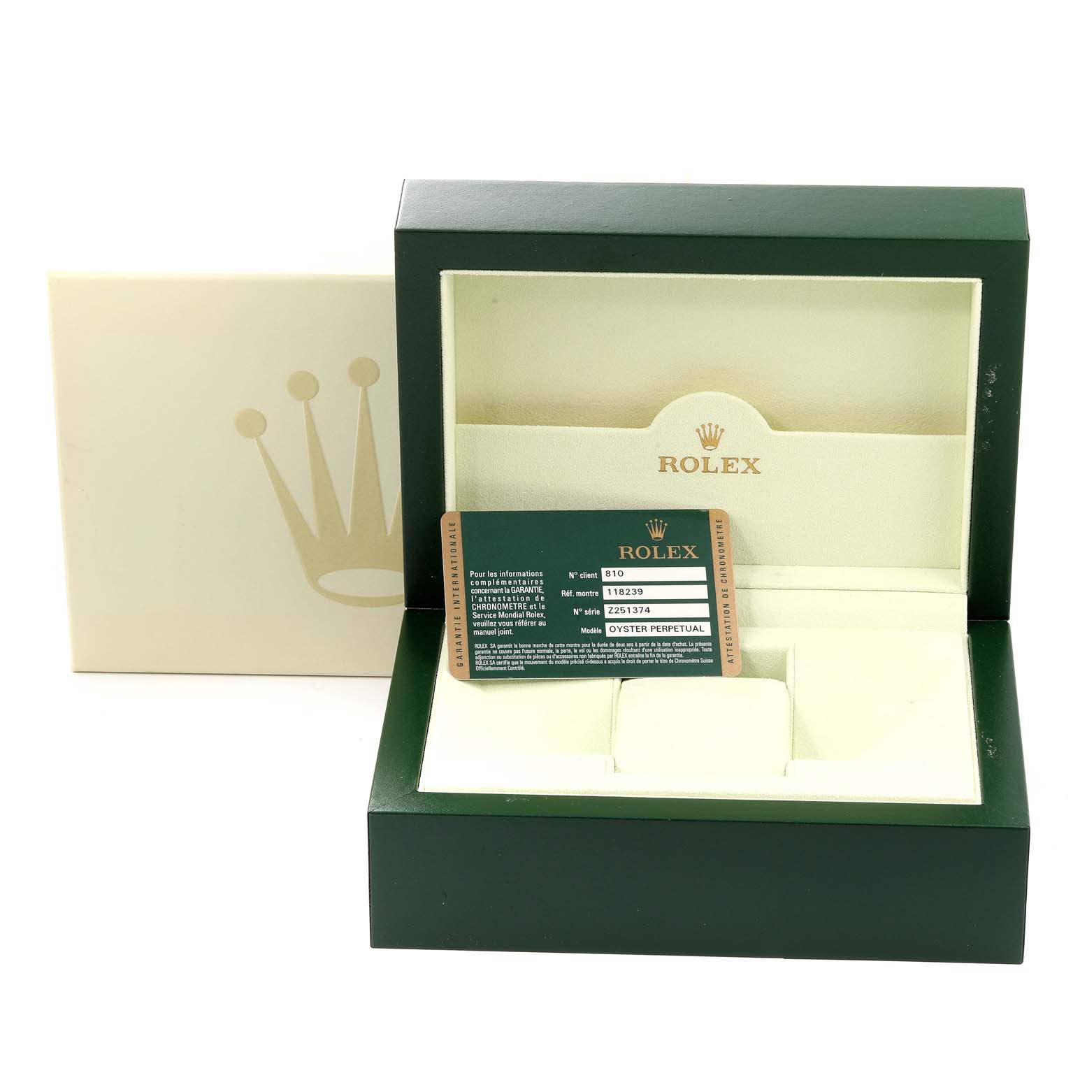 This image shows a green Rolex President 118239 Men's White Gold Silver Dial 118239 Men's White Gold Silver Dial model box with a warranty card and interior cushioning on display.