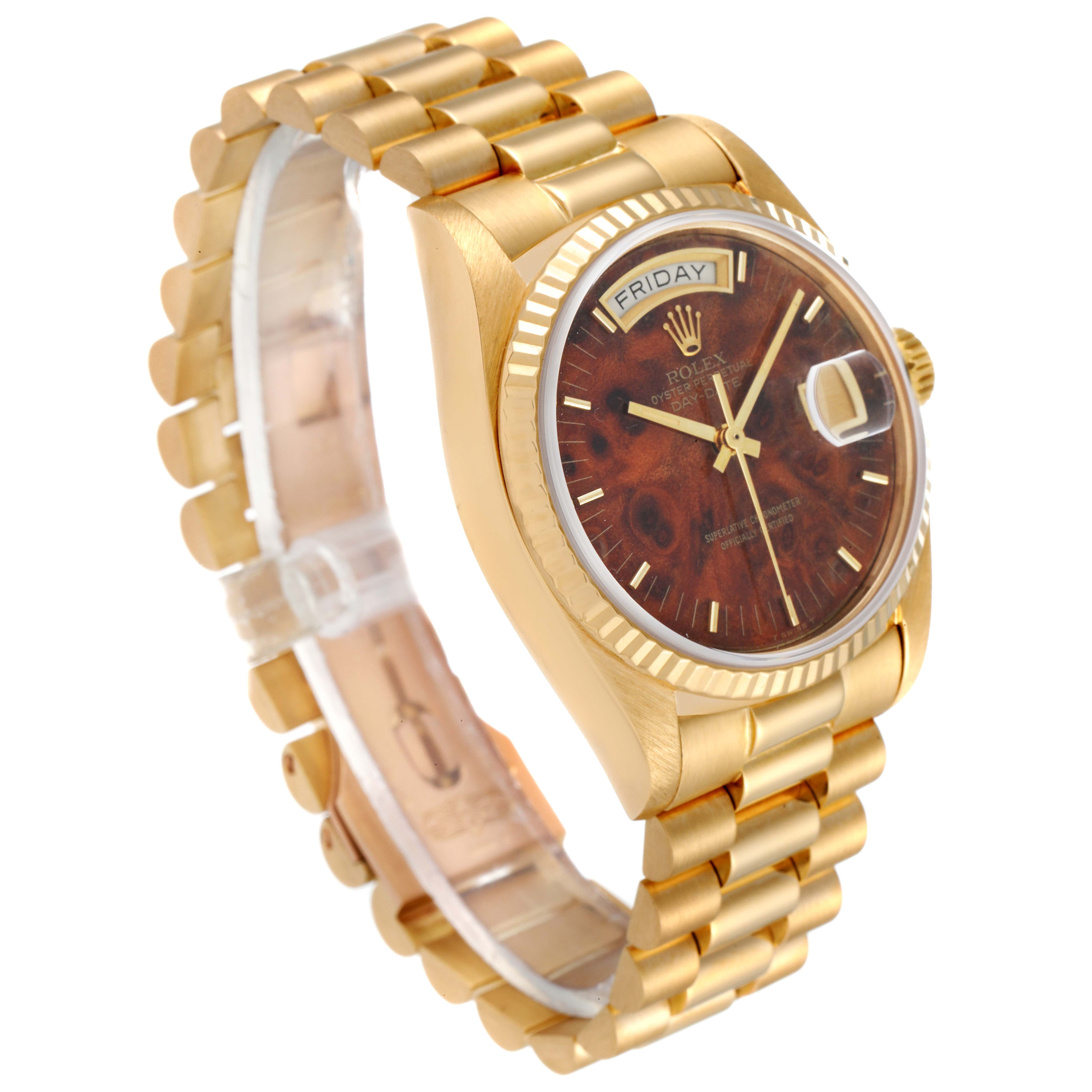 This image shows the Rolex President 18038 Men's Yellow Gold Brown Dial 18038 Men's Yellow Gold Brown Dial watch at an angle displaying its gold bracelet, bezel, and face with a day and date function.
