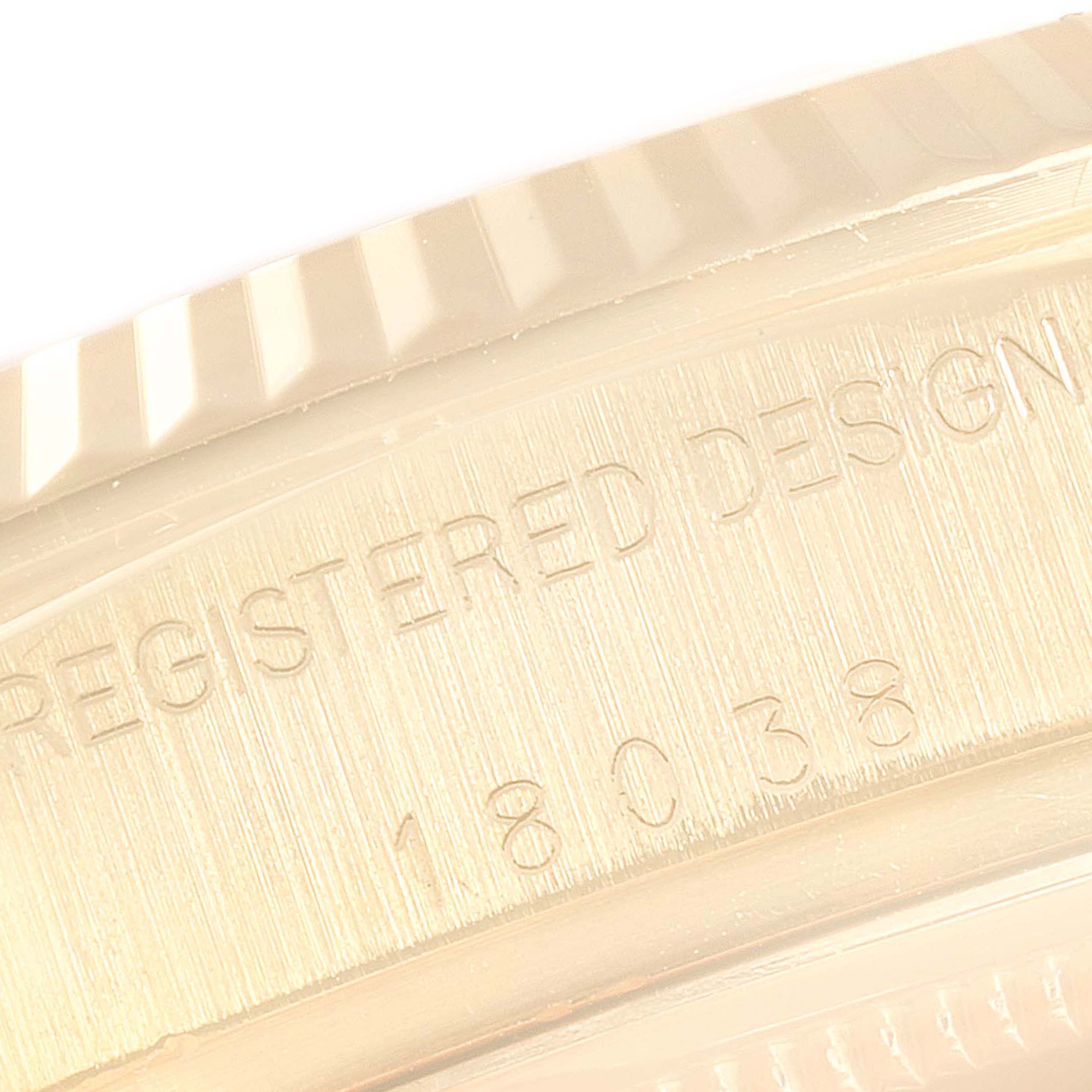 This is a close-up shot of the case edge and engraved serial number of a Rolex President 18038 Men's Yellow Gold Brown Dial 18038 Men's Yellow Gold Brown Dial model watch.