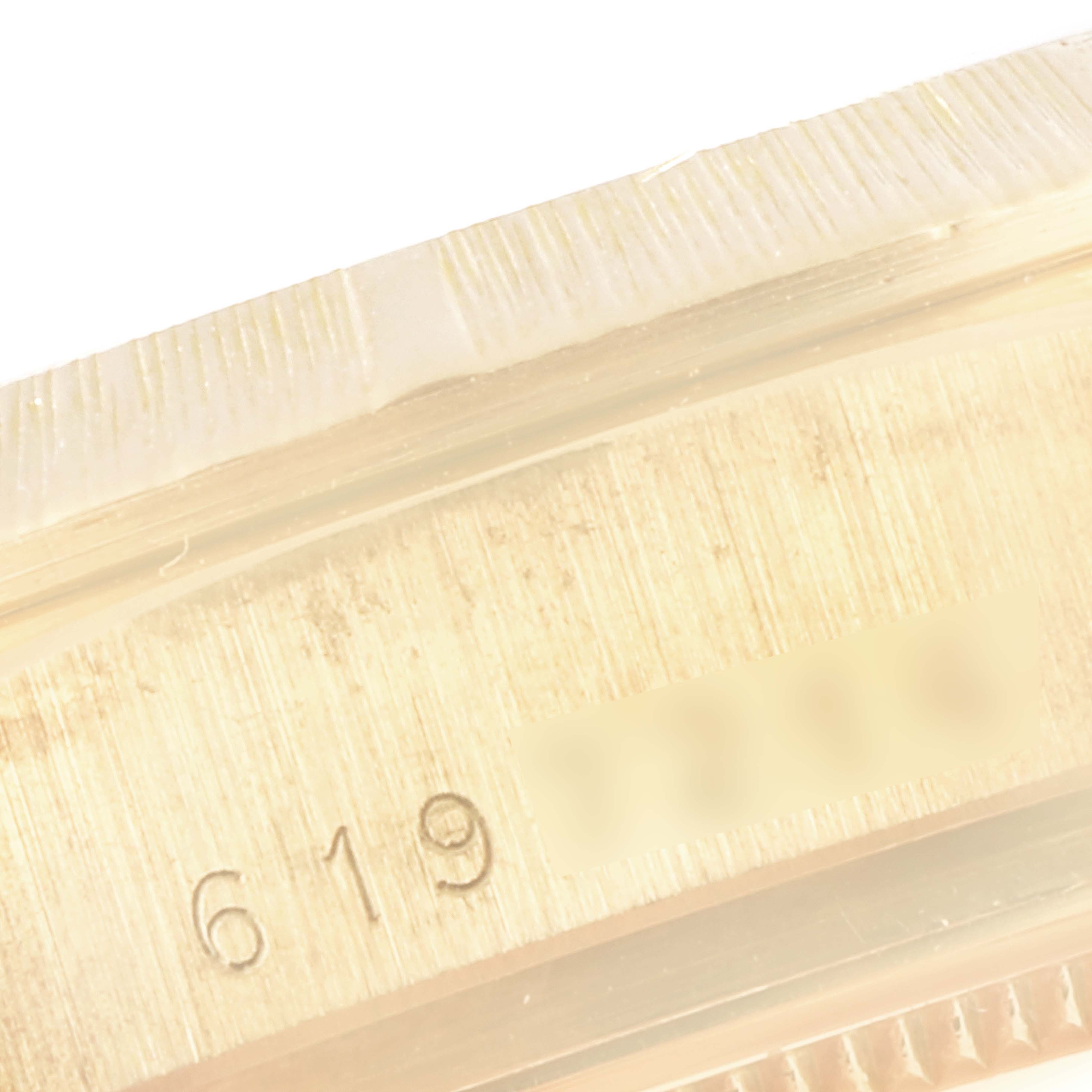 The image shows a close-up of the serial number engraving on the bezel of the Rolex President 18038 Men's Yellow Gold Brown Dial 18038 Men's Yellow Gold Brown Dial model watch.