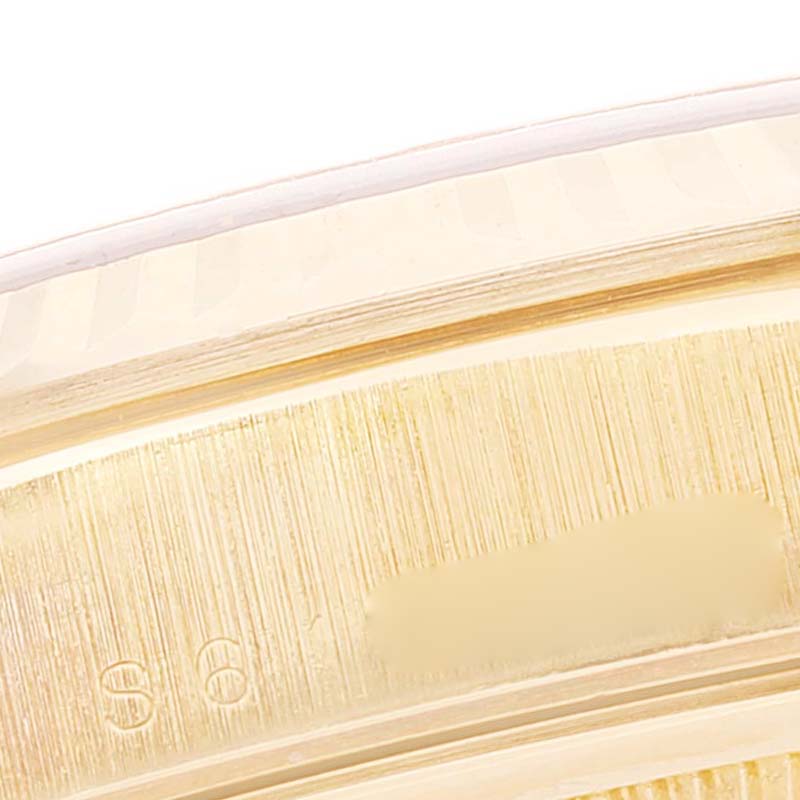 This close-up image shows the edge of the bezel and part of the case back of a Rolex President 18238 Men
s Yellow Gold Champagne Dial 18238 Men
s Yellow Gold Champagne Dial model watch.