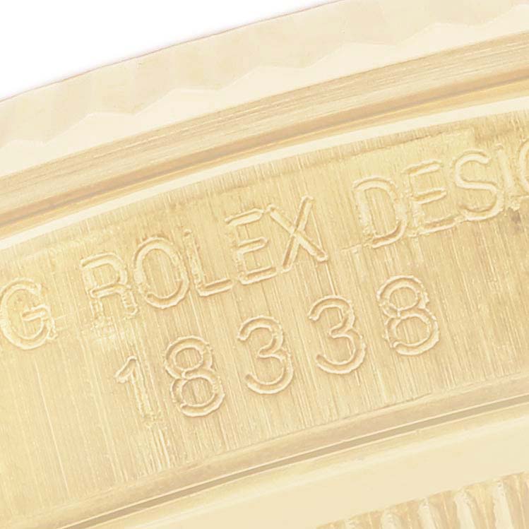 The image shows a close-up of the side engraving on a Rolex President 18338 Men's Yellow Gold Mother of Pearl Dial 18338 Men's Yellow Gold Mother of Pearl Dial model watch.